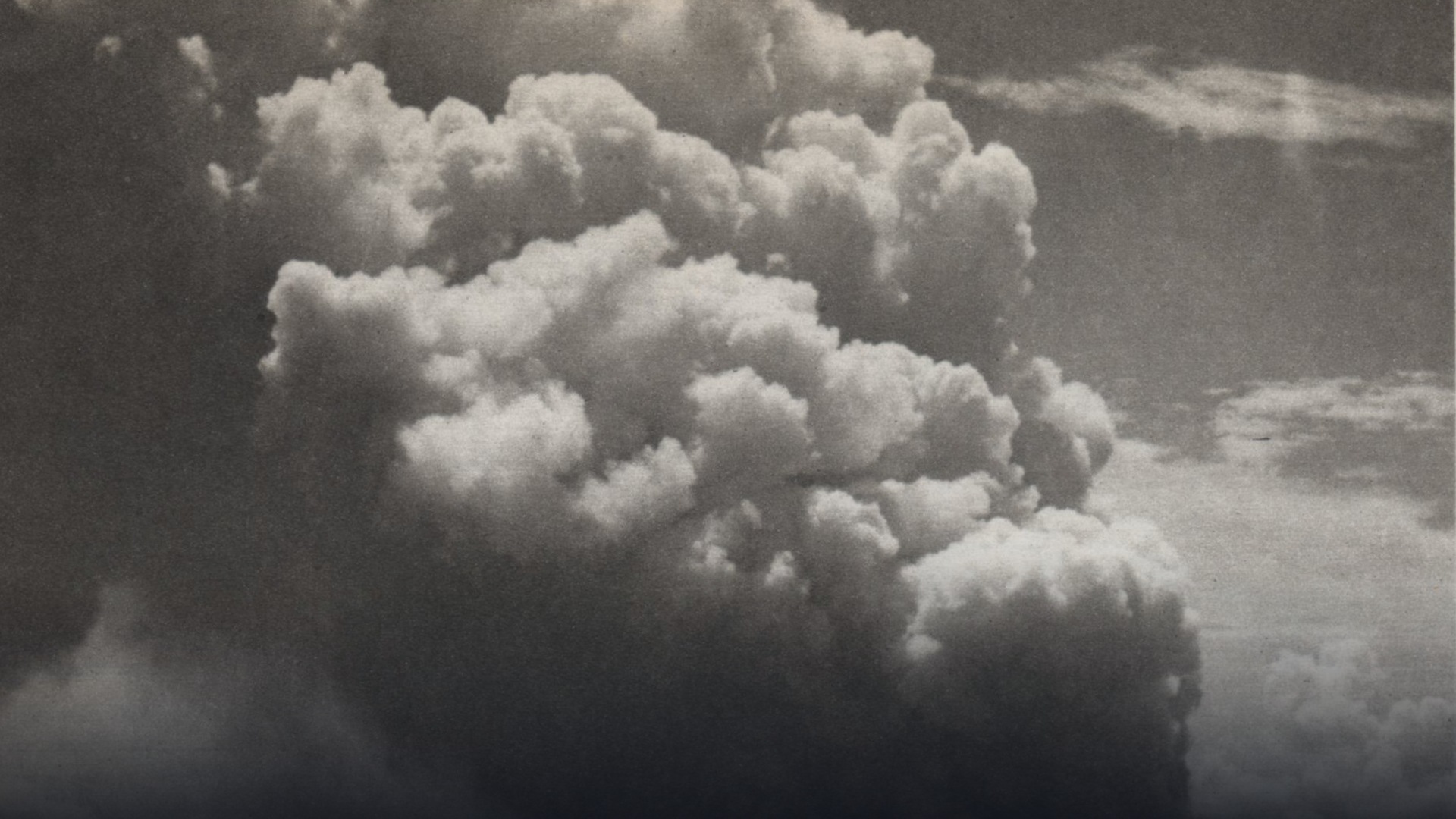 Explosive submarine volcanic plume of steam and ash bursting from the ocean surface at Myojin-sho in the Devil's Sea.