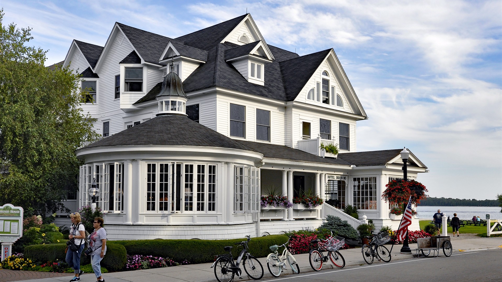 Historic Victorian Hotel Iroquois and bicycles along the car-free waterfront of Mackinac Island, Michigan