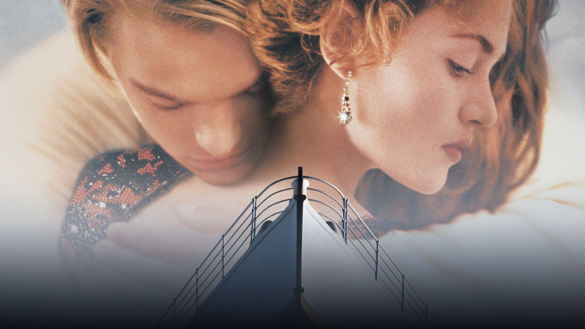Jack and Rose standing close at the bow of the RMS Titanic in the twilight breeze.