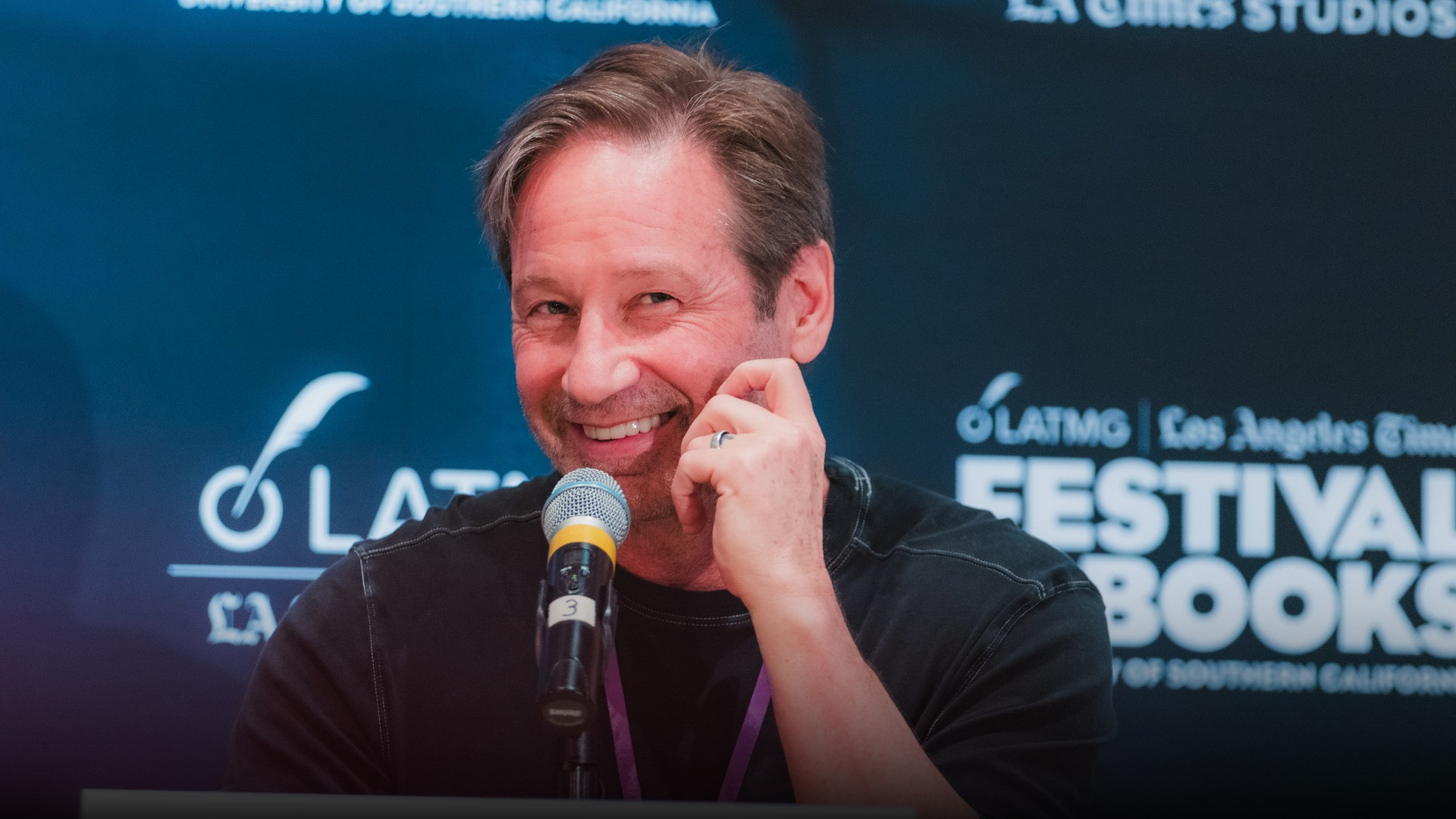 High-resolution portrait photograph of David Duchovny celebrating academic achievement.