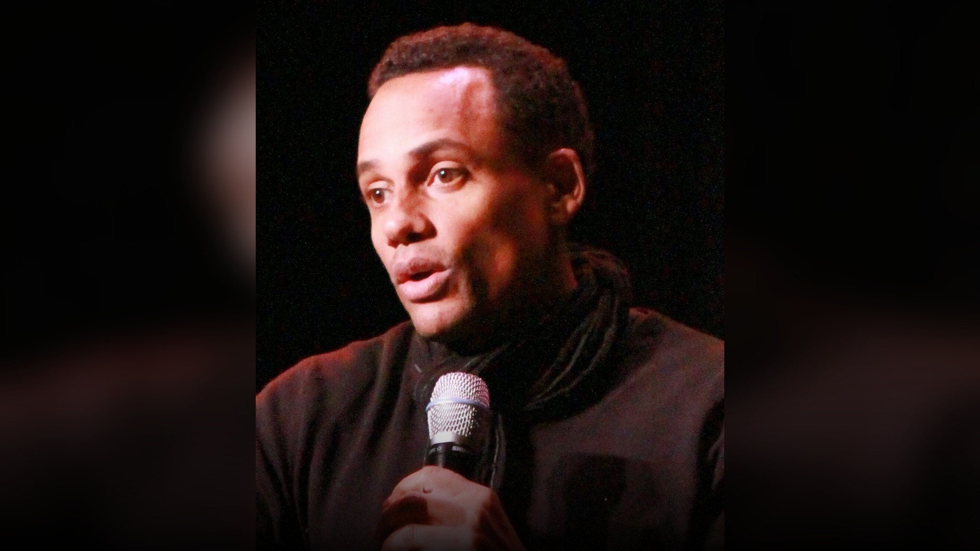 High-resolution portrait photograph of Hill Harper celebrating academic achievement.