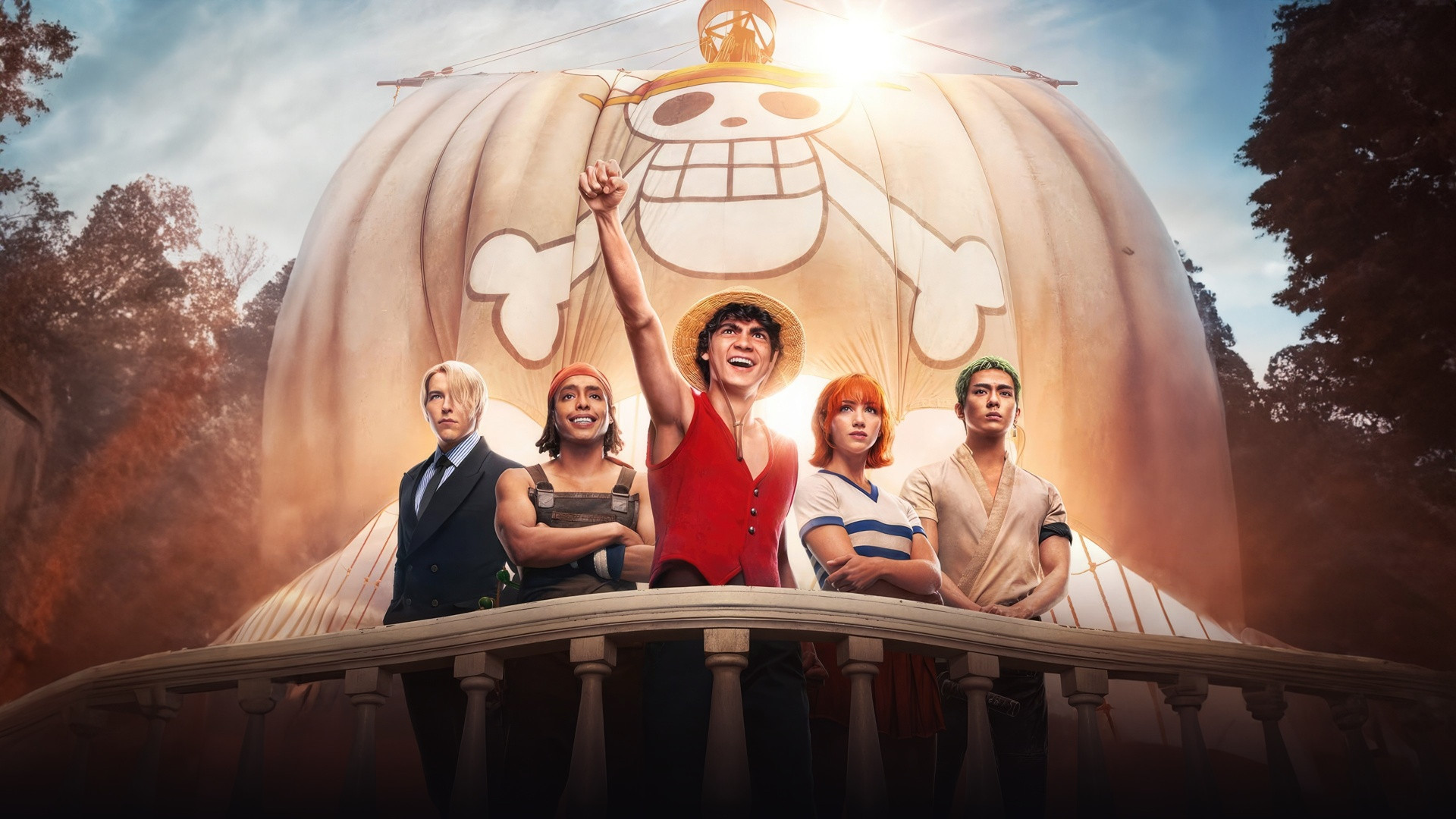 Iñaki Godoy as Monkey D. Luffy raising his fist with the Straw Hat pirates aboard the Going Merry.