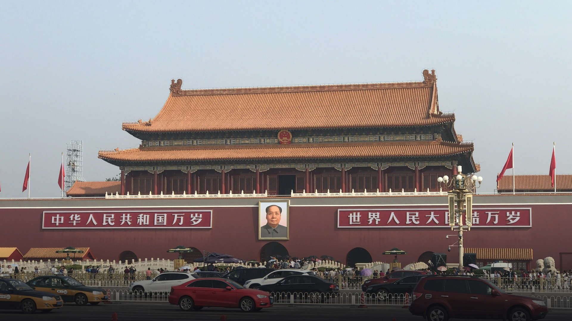 The monumental Gate of Heavenly Peace in Beijing with red ceremonial lanterns and grand portrait of Mao Zedong.