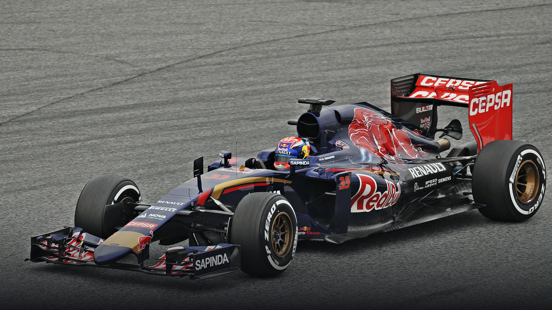 Max Verstappen steering his Scuderia Toro Rosso car along the curbs during the British Grand Prix.