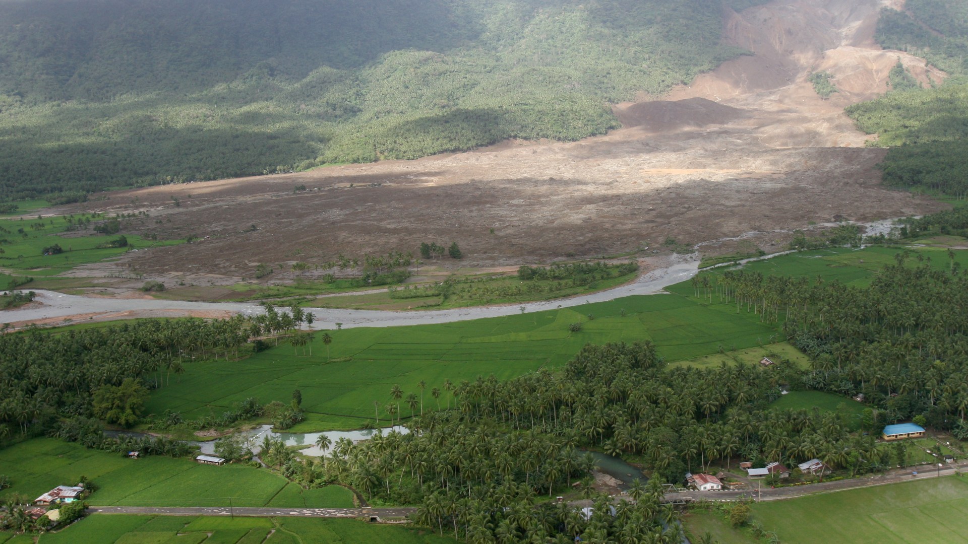 Aerial view of the massive mountainside collapse and mudslide deposit that buried the village of Guinsaugon in Southern Leyte, Philippines, in February 2006.