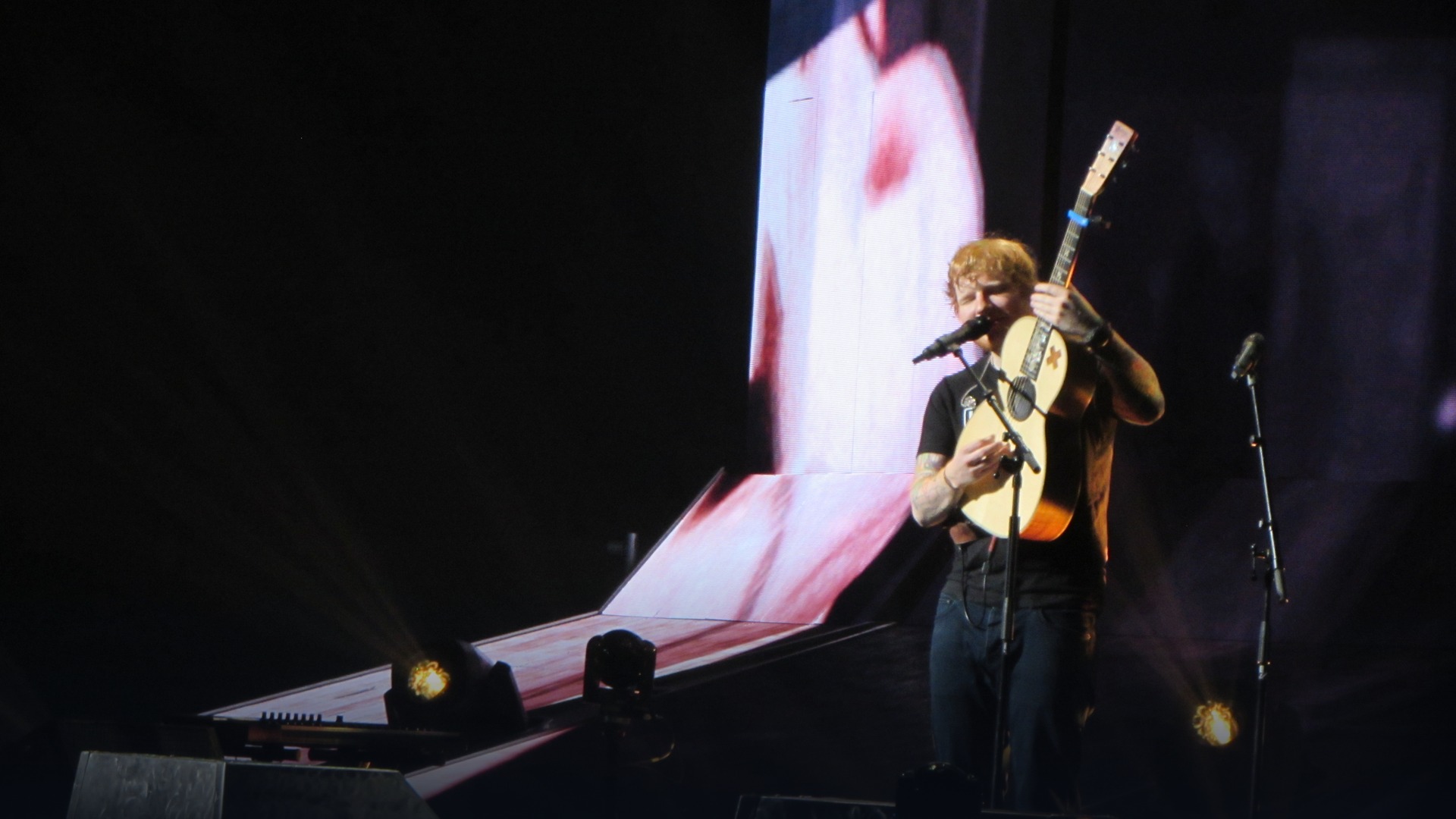 Ed Sheeran seated casually in New York in profile.