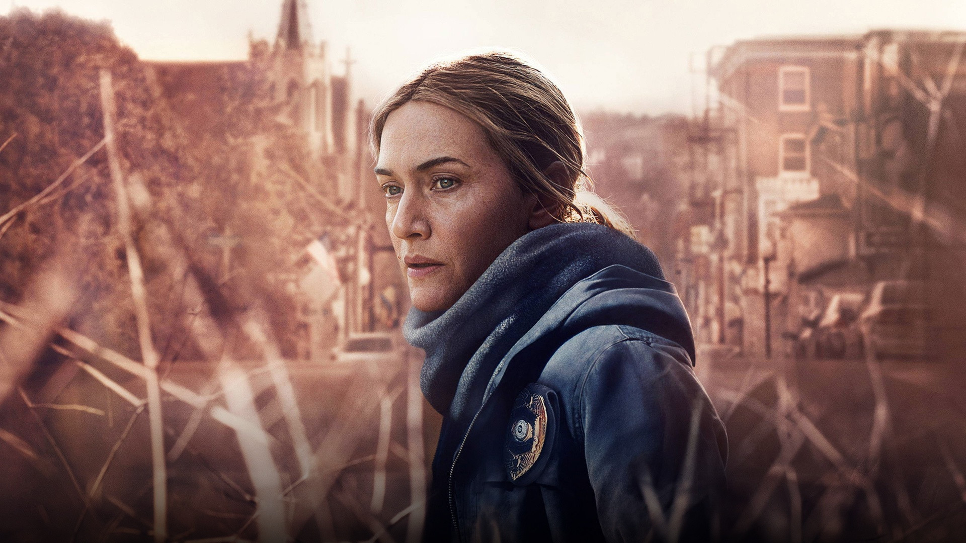 Kate Winslet as Detective Mare Sheehan looking pensive in Mare of Easttown