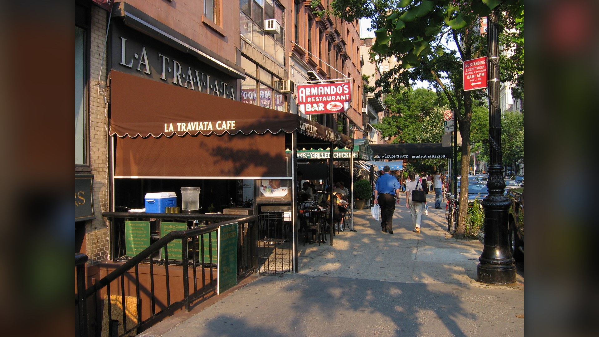 Montague Street sidewalk cafes and local storefronts in Brooklyn Heights.