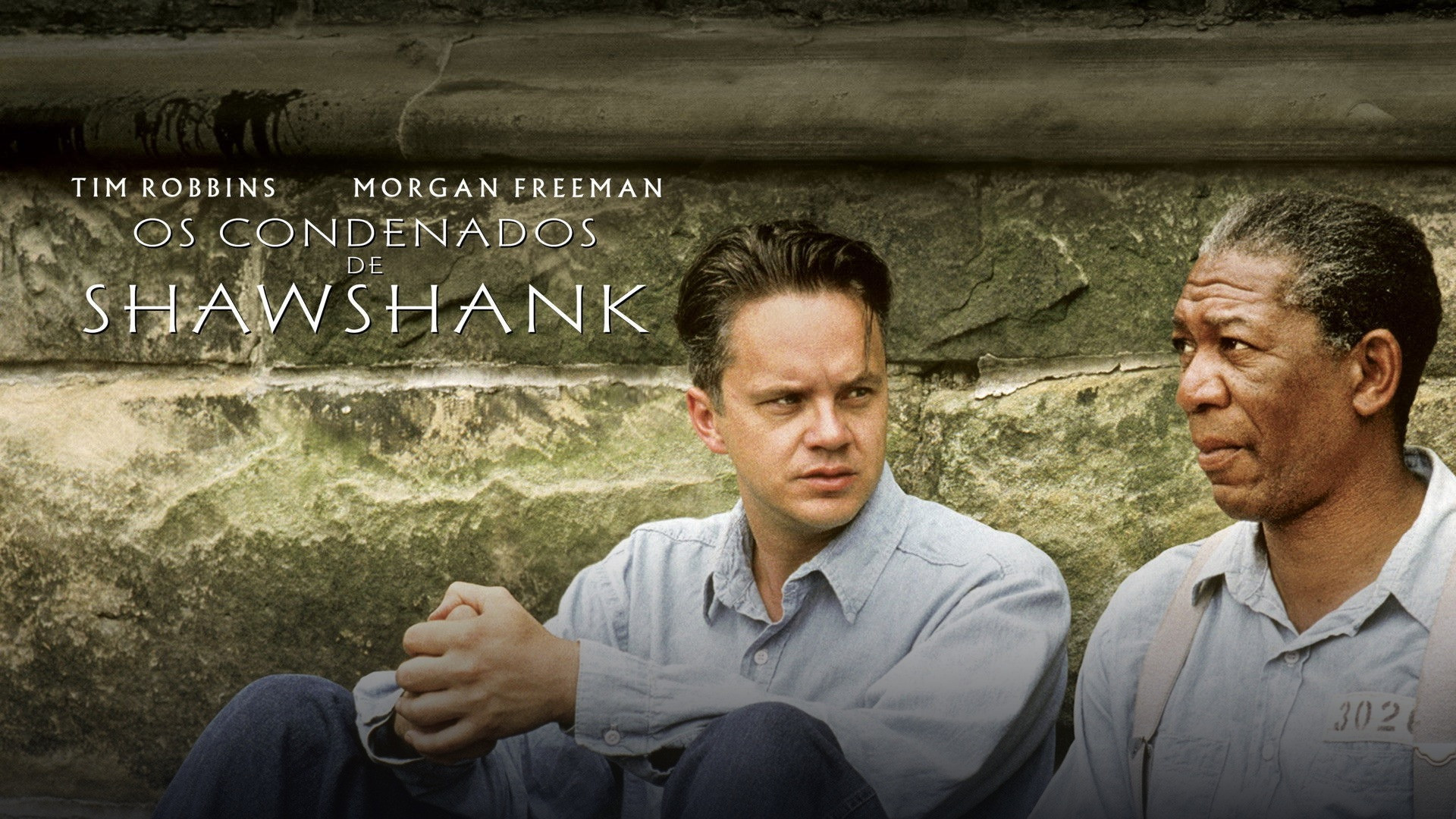 Andy Dufresne standing in the rain with arms outstretched in The Shawshank Redemption.