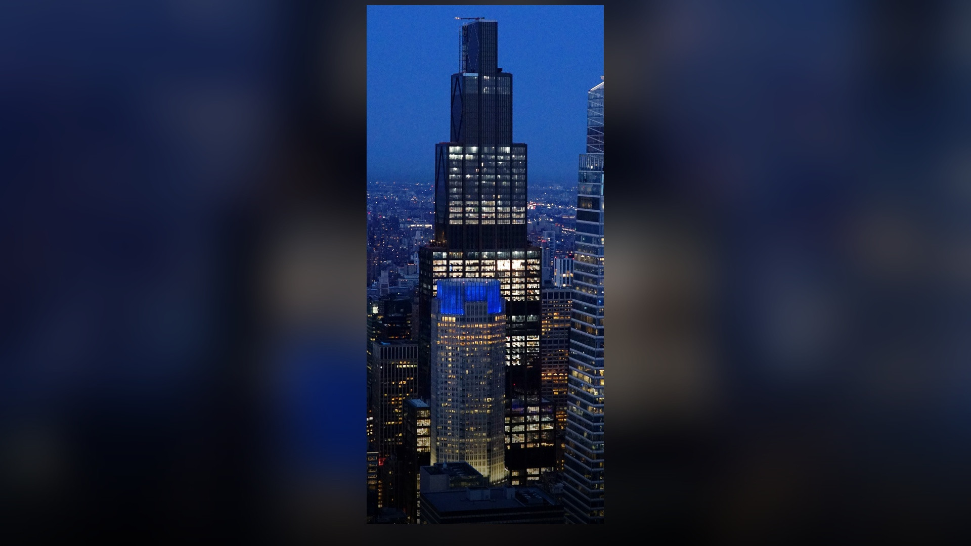 An elevated architectural view of the completed 270 Park Avenue supertall illuminated at dusk against the Midtown Manhattan skyline.