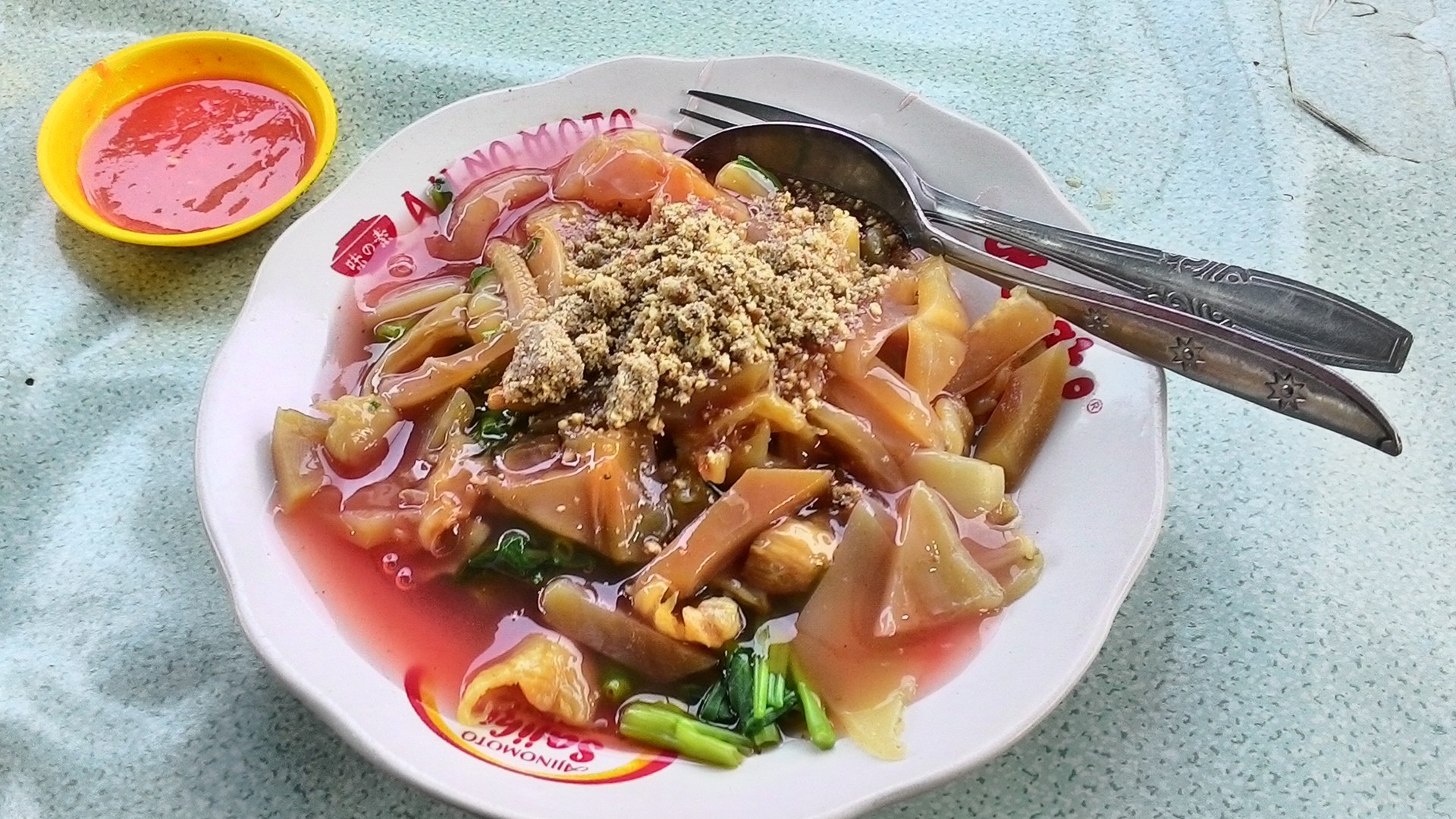 Prepared edible jellyfish snack dish served with crunchy toppings