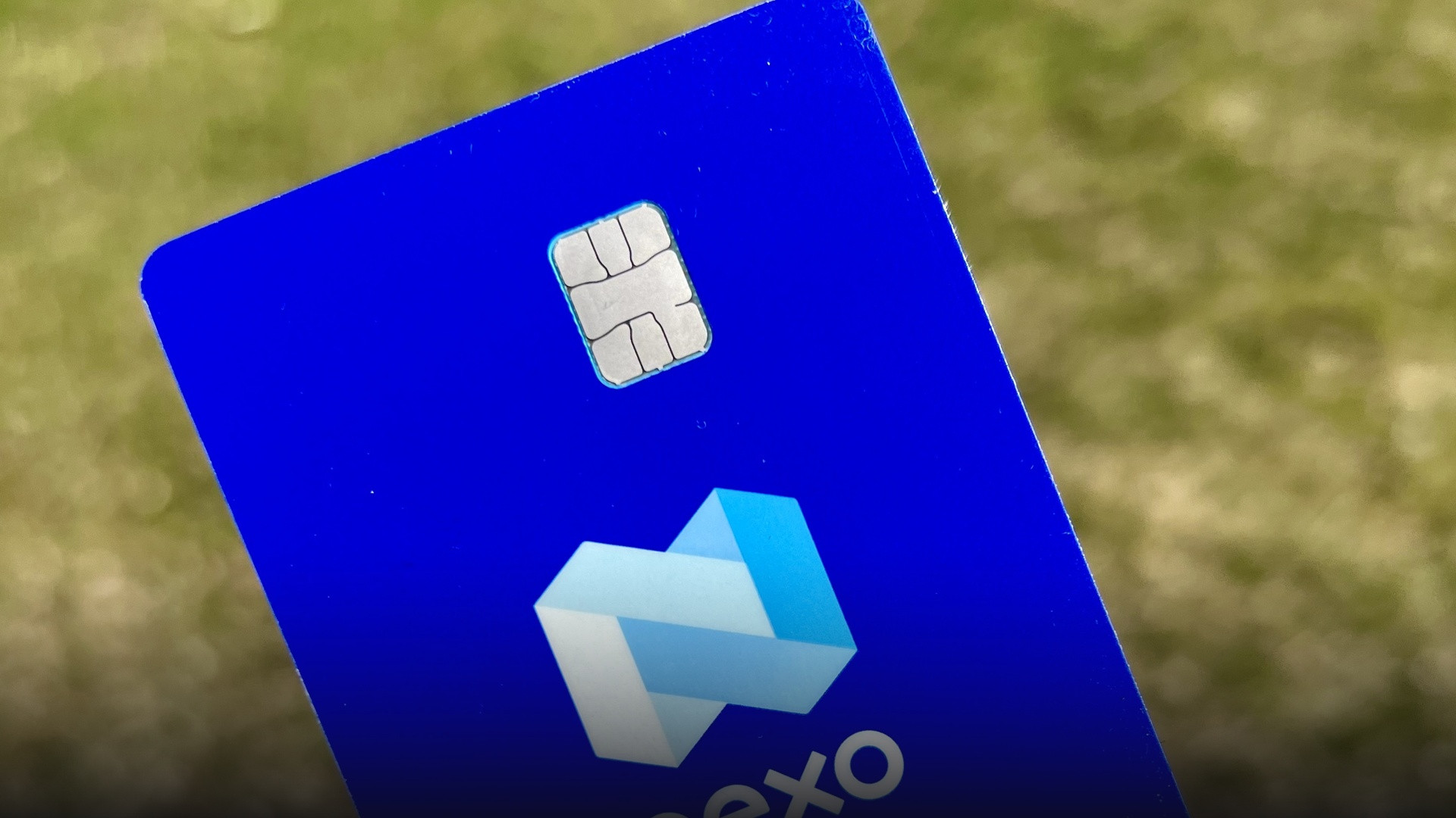 Close-up of a sleek digital virtual payment credit card with chip and security contact elements.
