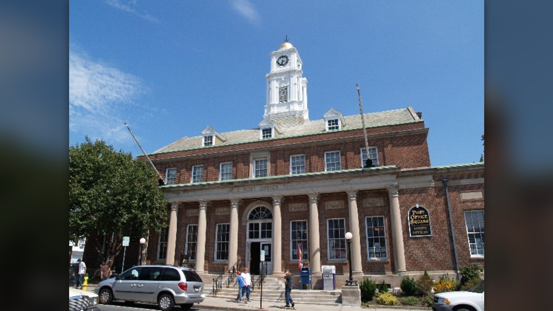 Historic brick facade of the Old U.S. Post Office building in Plymouth, Massachusetts.