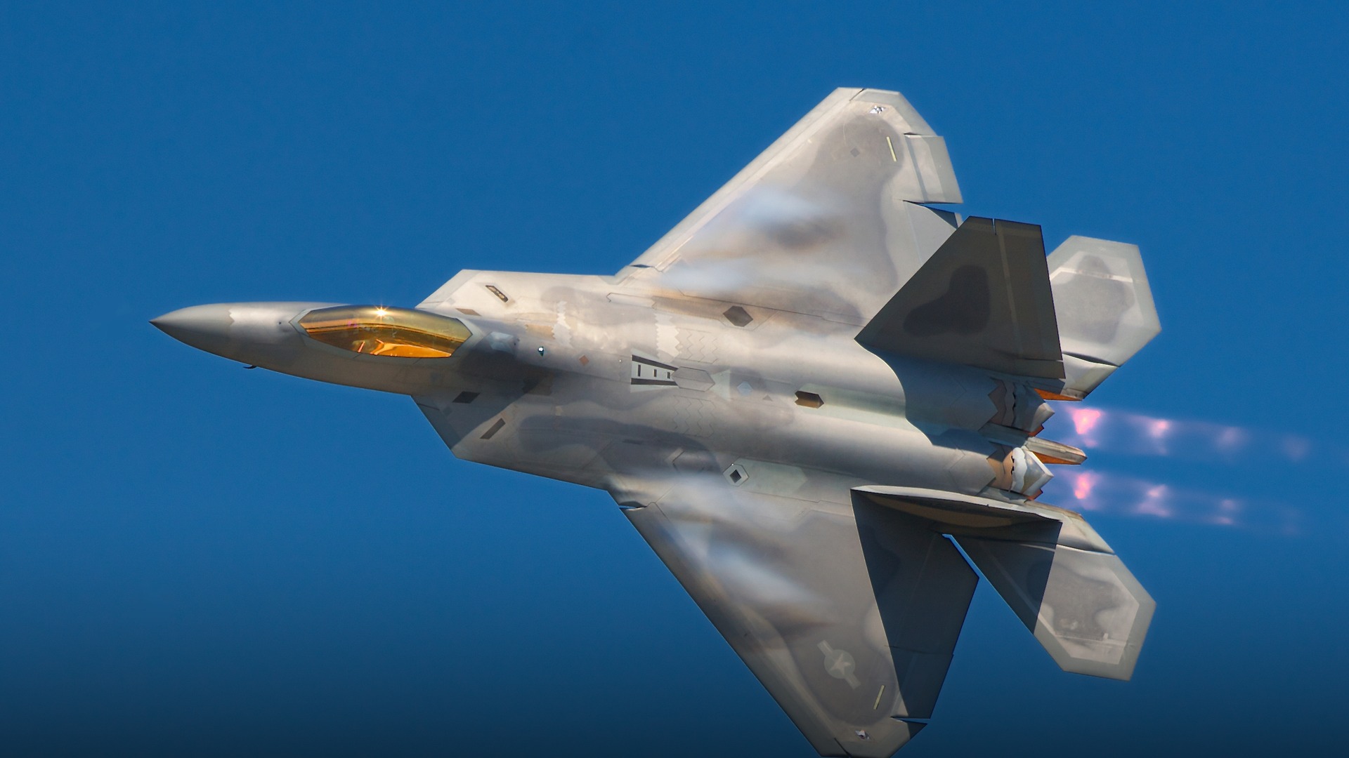 Lockheed Martin F-22A Raptor air superiority stealth fighter demonstrating agility in mid-flight.