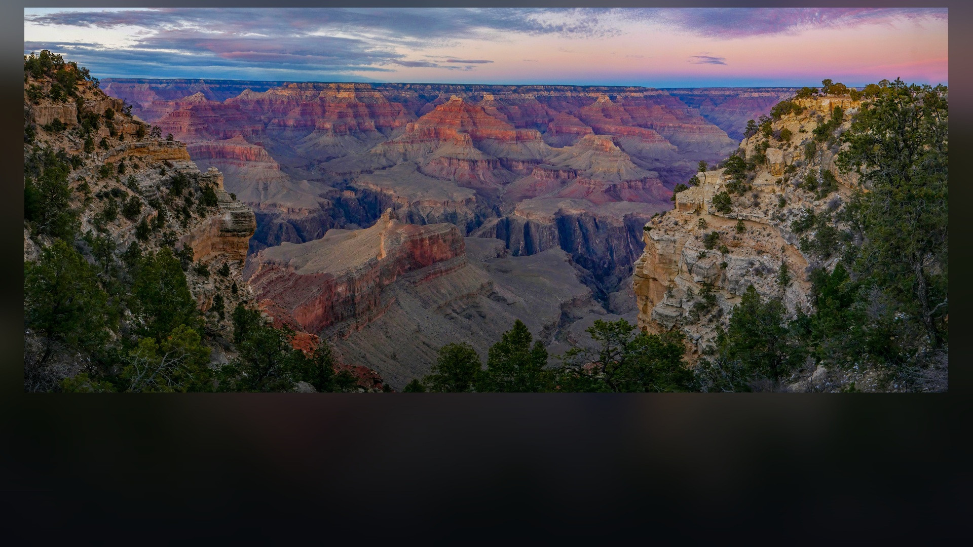Panoramic landscape vista of Grand Canyon National Park showing natural geological formations, terrain, and wilderness.