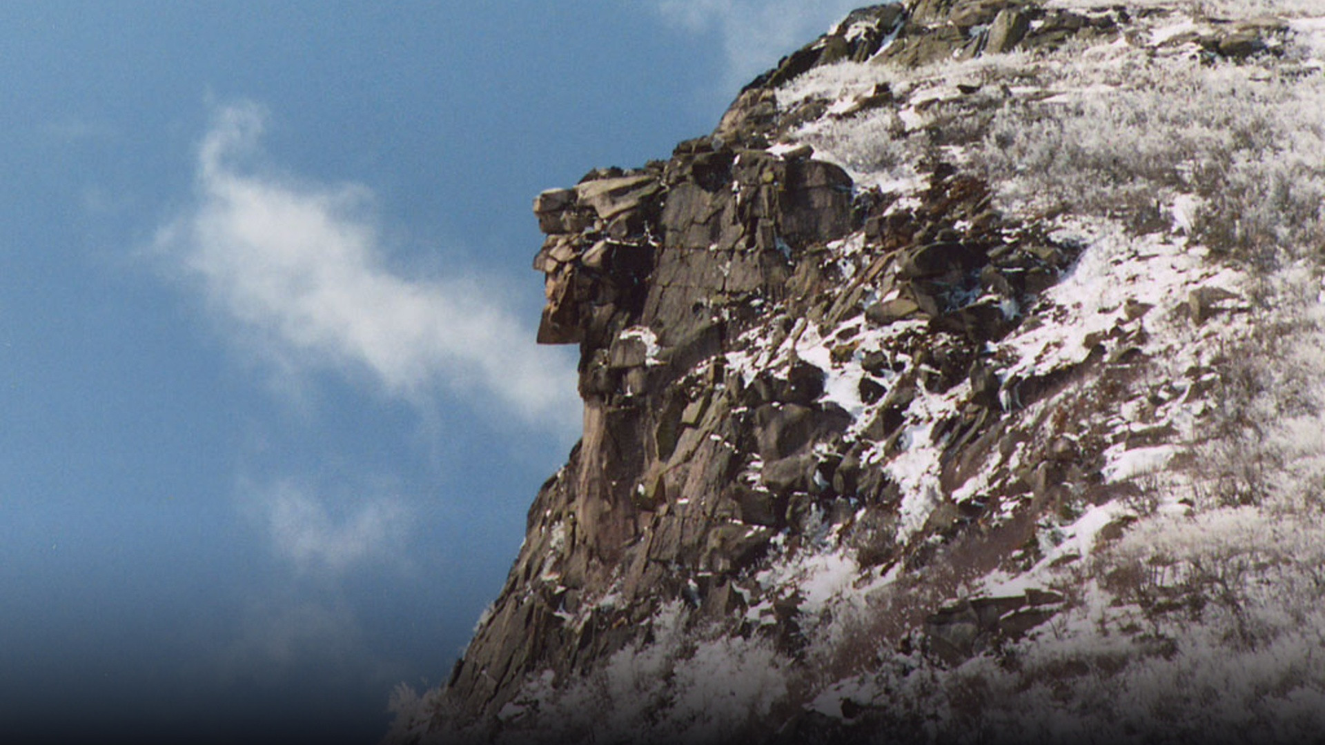 Iconic close-up profile of the Old Man of the Mountain granite rock face in Franconia Notch photographed in 2003.