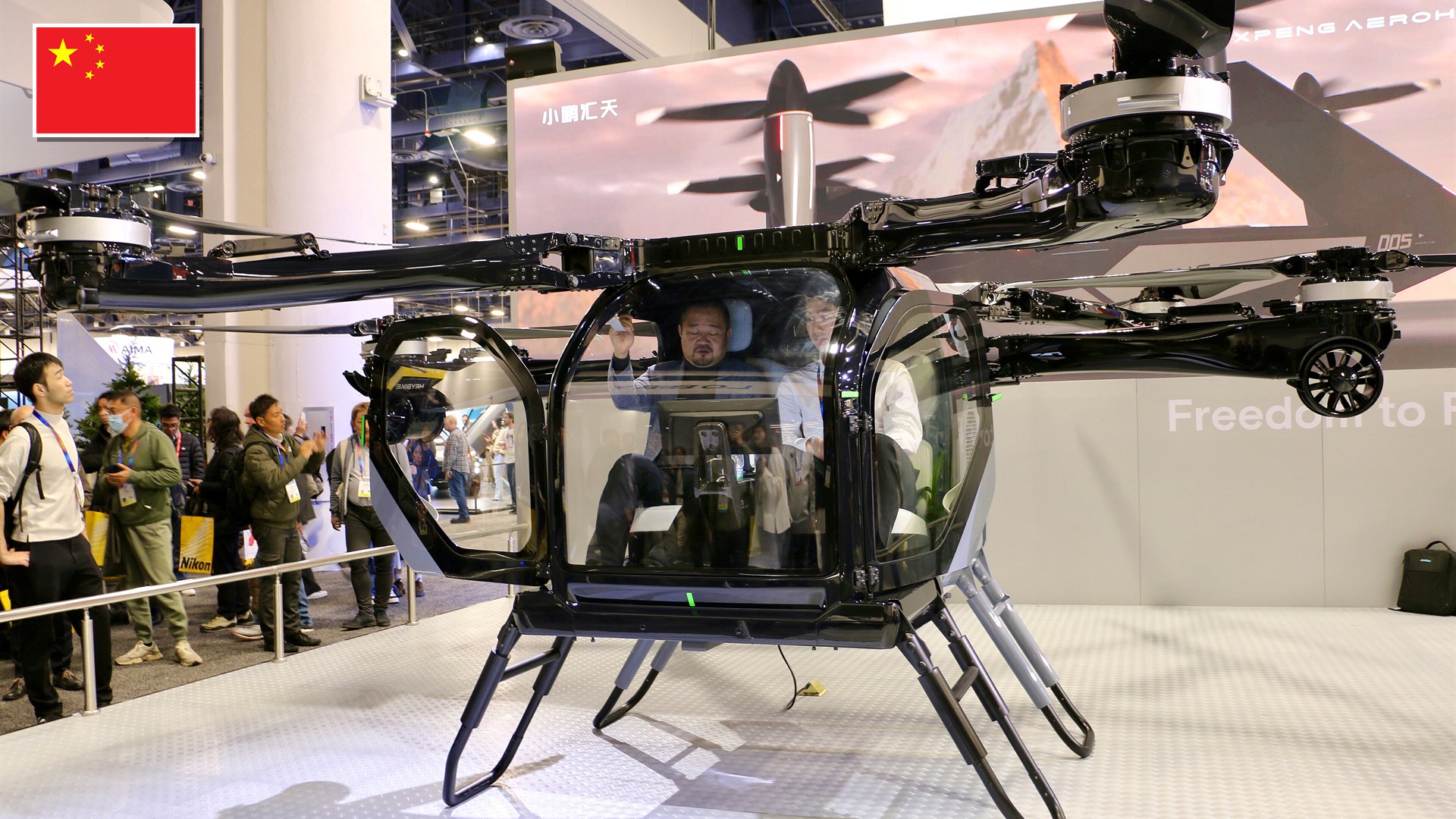 XPENG AEROHT Land Aircraft Carrier modular flying car at CES 2025 with the flag of China in the top-left corner.