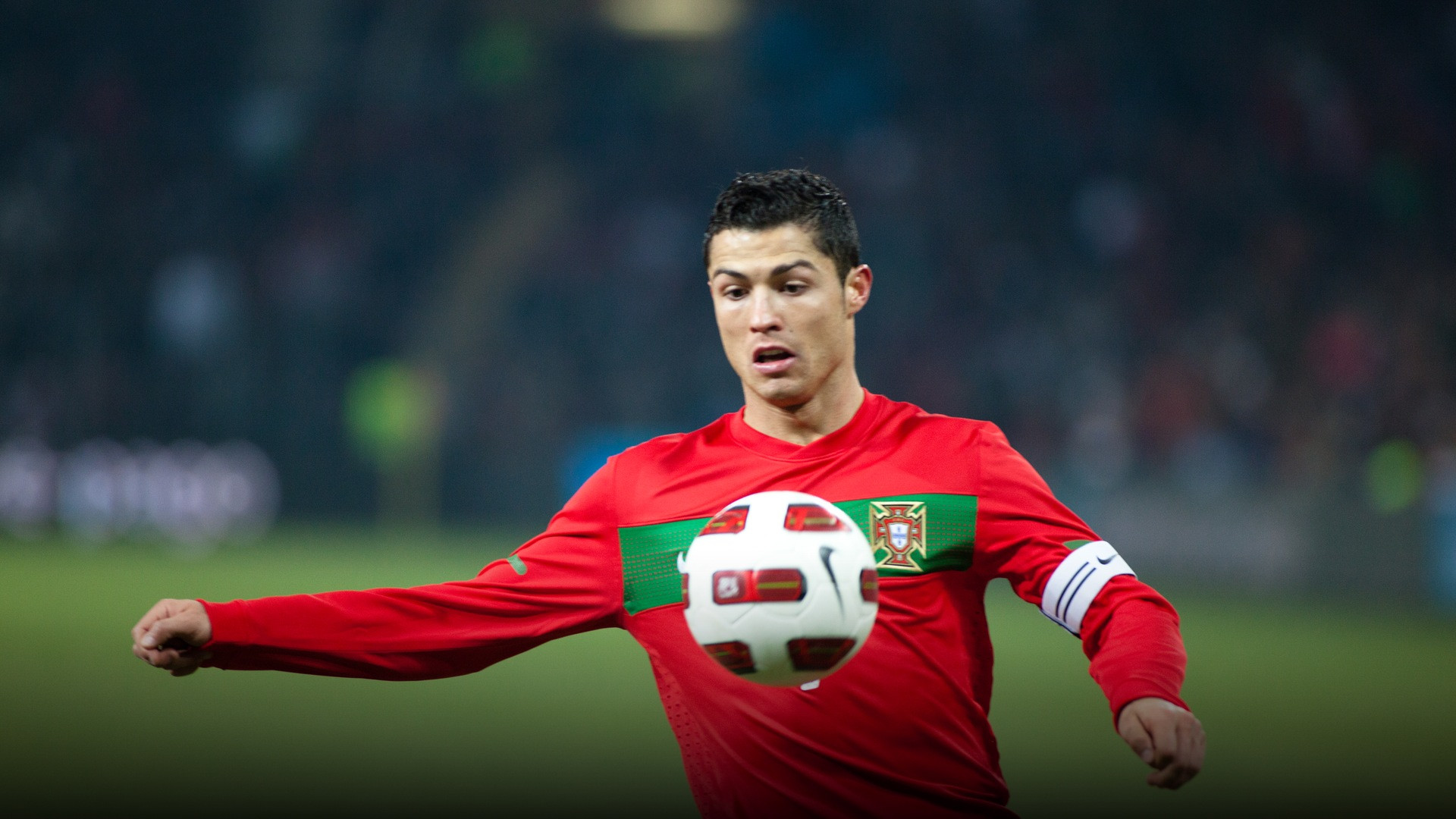 Cristiano Ronaldo competing for Portugal against Argentina in an international match.