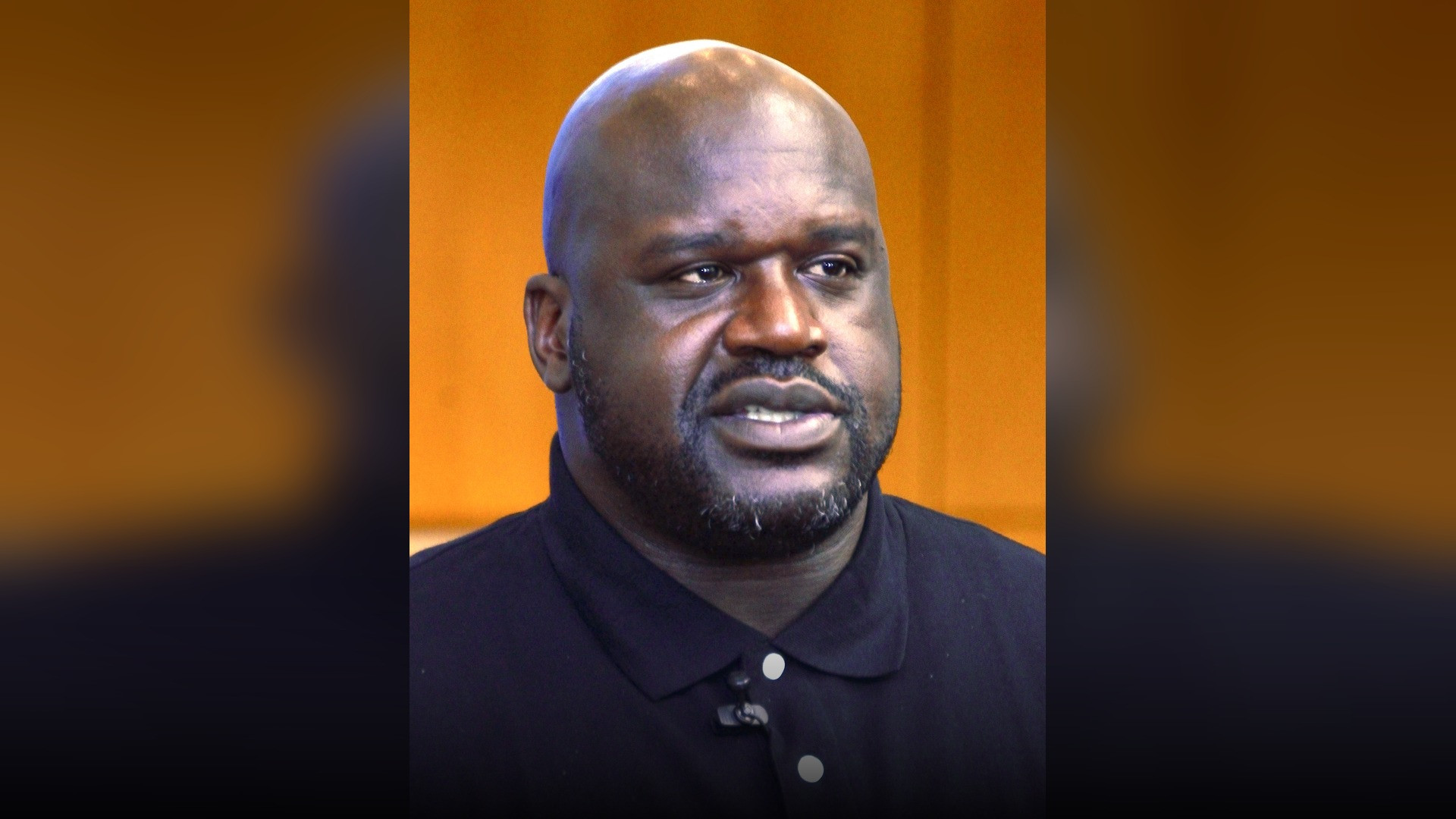 High-resolution portrait photograph of Shaquille O'Neal celebrating academic achievement.