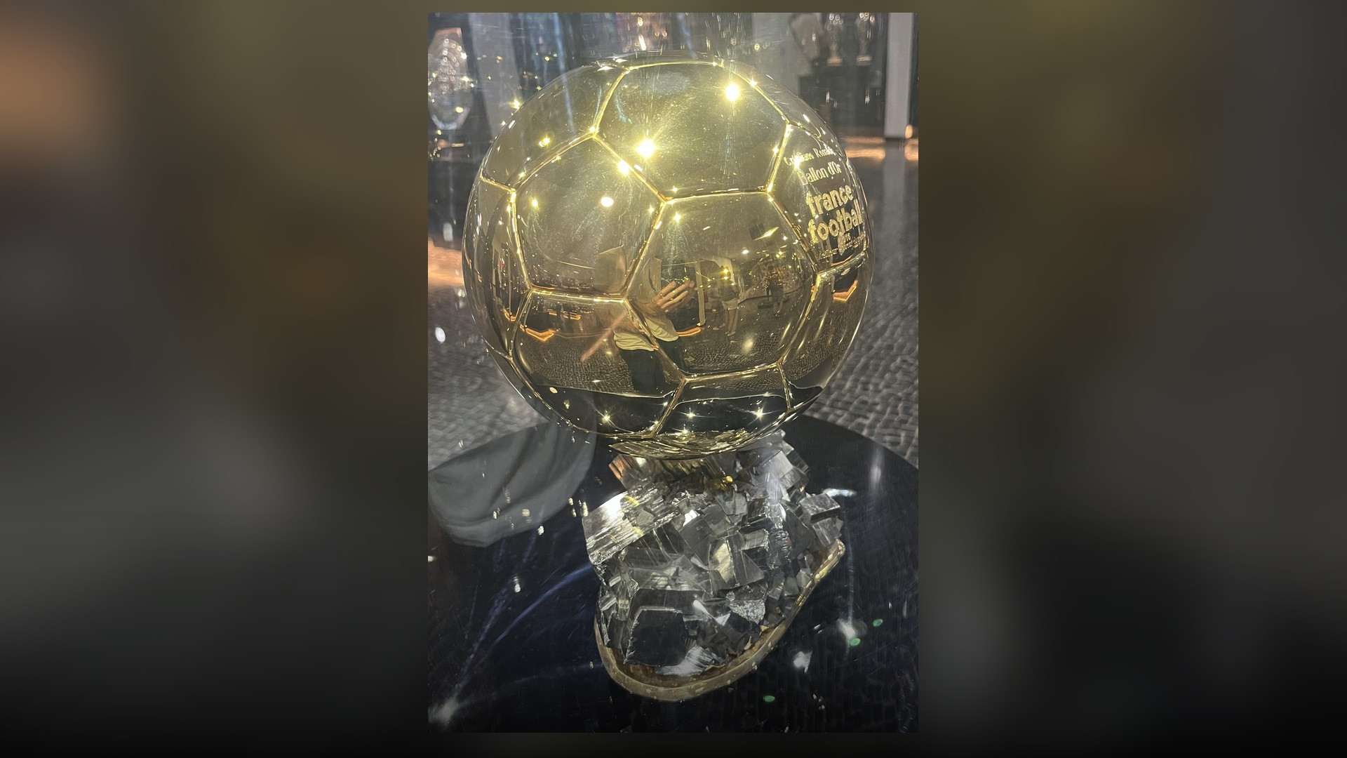 Golden individual football award trophy on display inside the CR7 Museum trophy room.