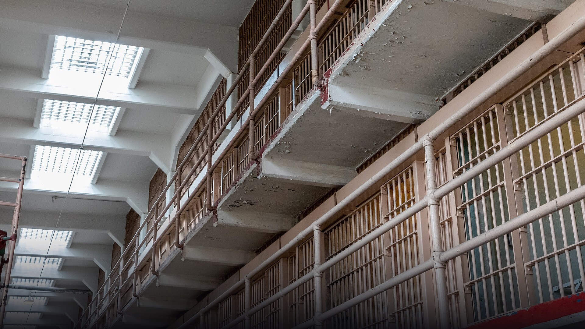 Multi-tier steel cellblocks and central corridor inside the main cellhouse of Alcatraz Federal Penitentiary in San Francisco Bay.