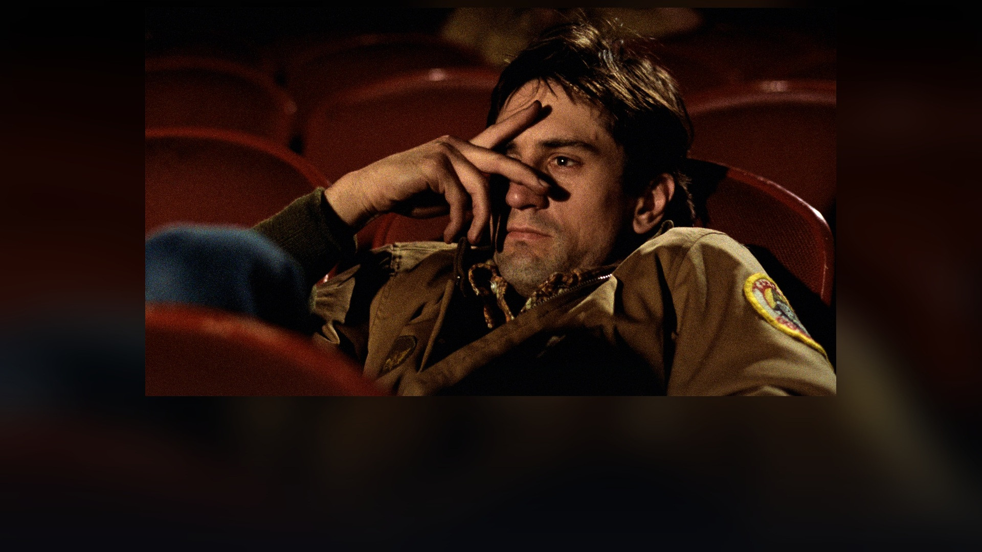 Robert De Niro as Travis Bickle in his military jacket in Taxi Driver.