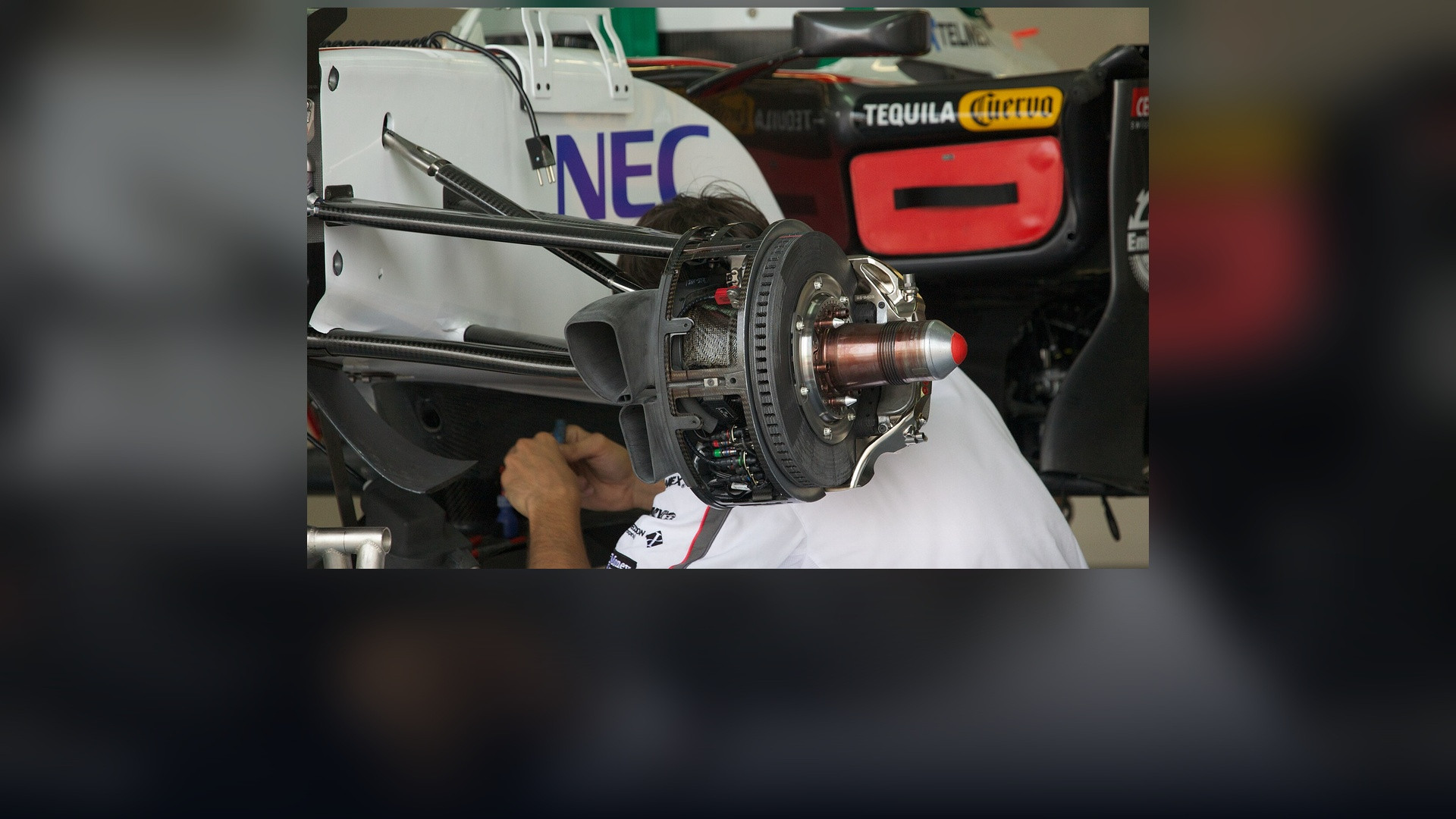 Formula 1 carbon brake assembly and brake duct aerofoils on a Sauber F1 car.