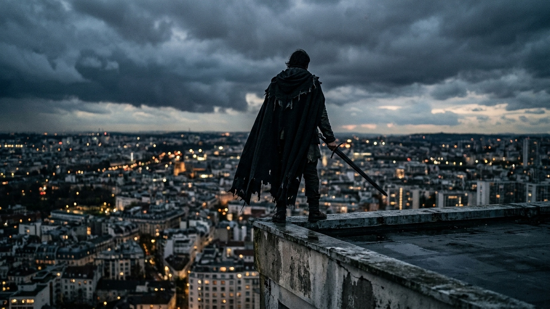 A hooded figure in frayed black cloak standing on a concrete rooftop ledge overlooking city lights holding a steel sword.