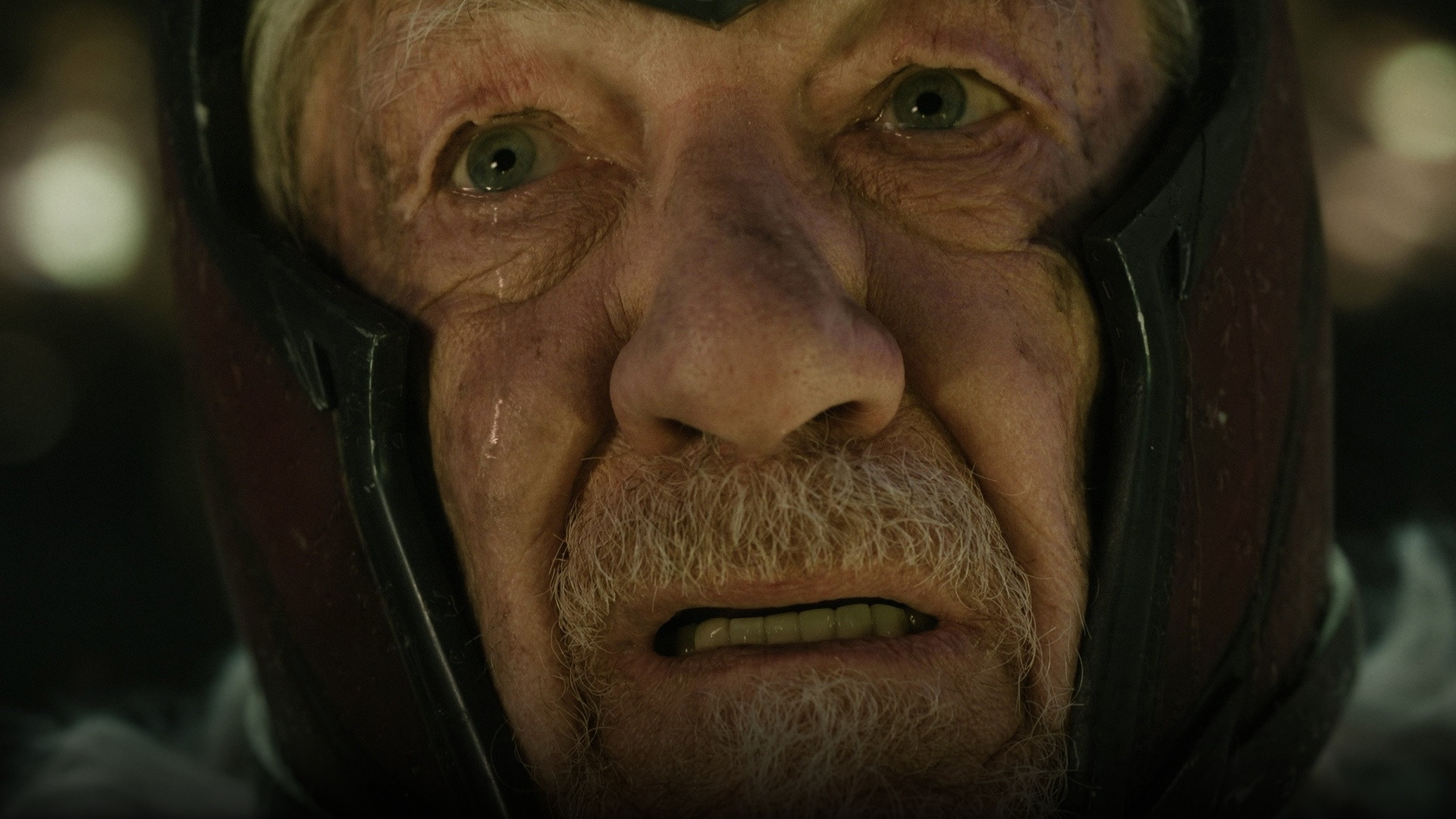 Ian McKellen as Erik Lehnsherr in his iconic Magneto battle helmet.