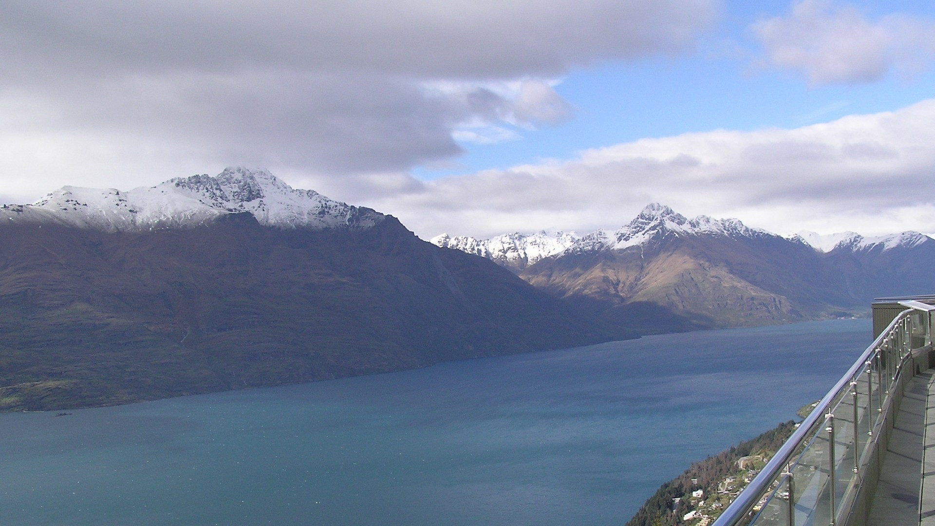 Panoramic skyline view of Lake Wakatipu and the Remarkables mountain range from the Skyline Gondola in Queenstown.