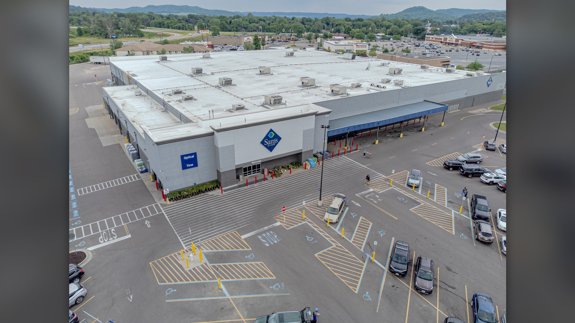 Sam's Club warehouse store exterior in Onalaska, Wisconsin, illustrating low unit pricing via its bulk warehouse membership model at #10.