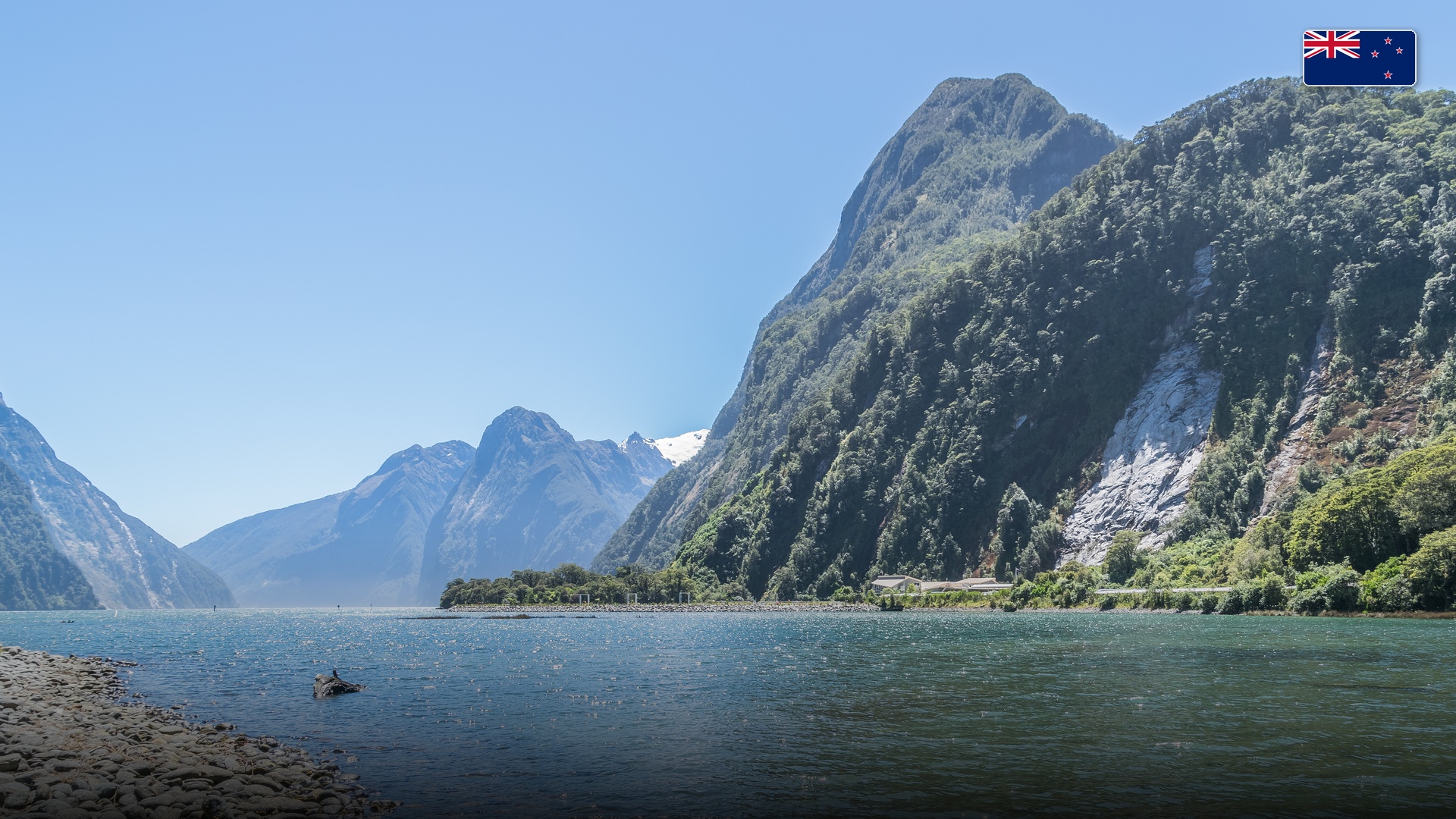Majestic Mitre Peak rising sharply above the tranquil waters of Milford Sound in Fiordland.
