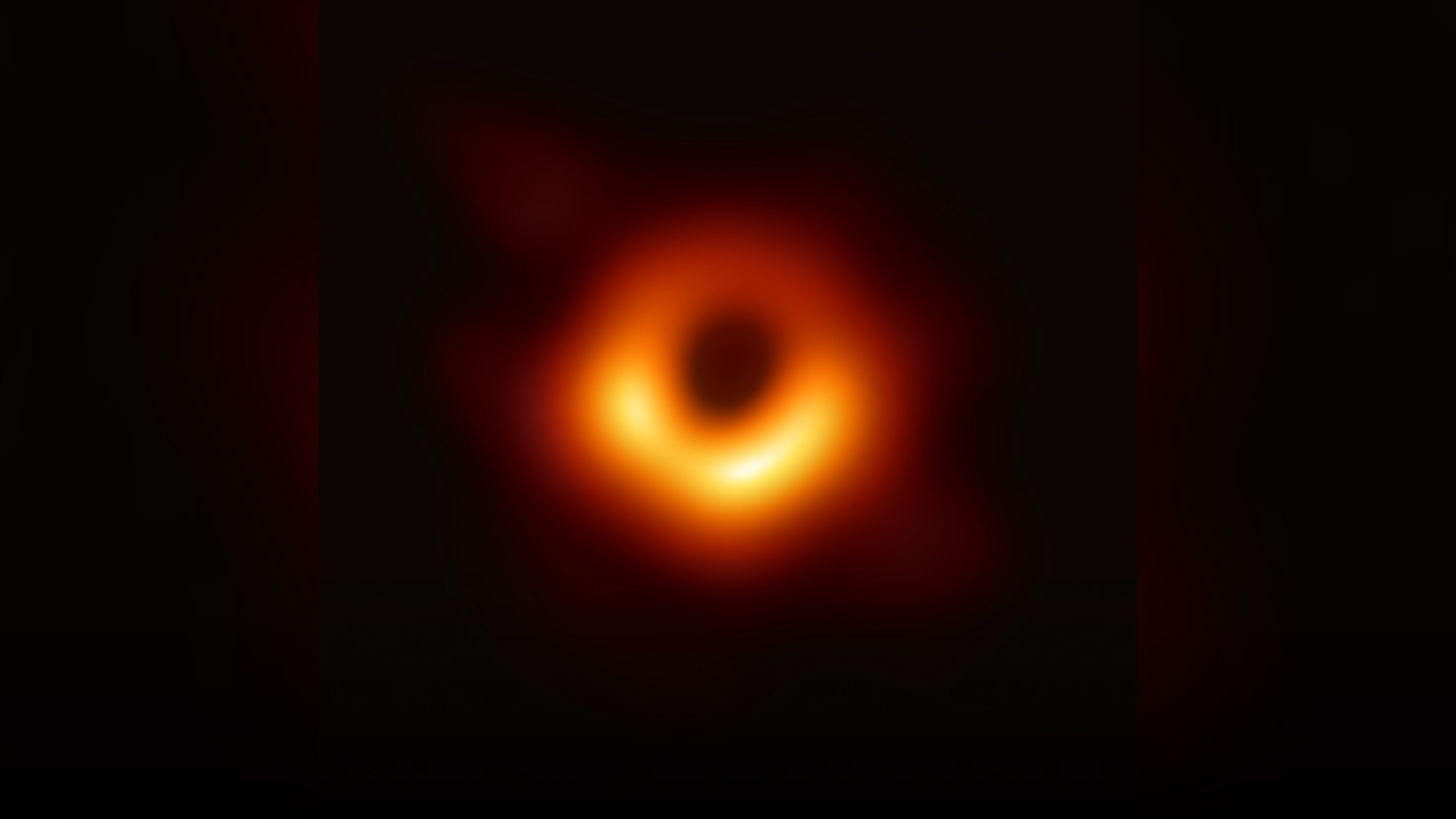 The historic first direct photograph of the supermassive black hole event horizon at the center of galaxy Messier 87.