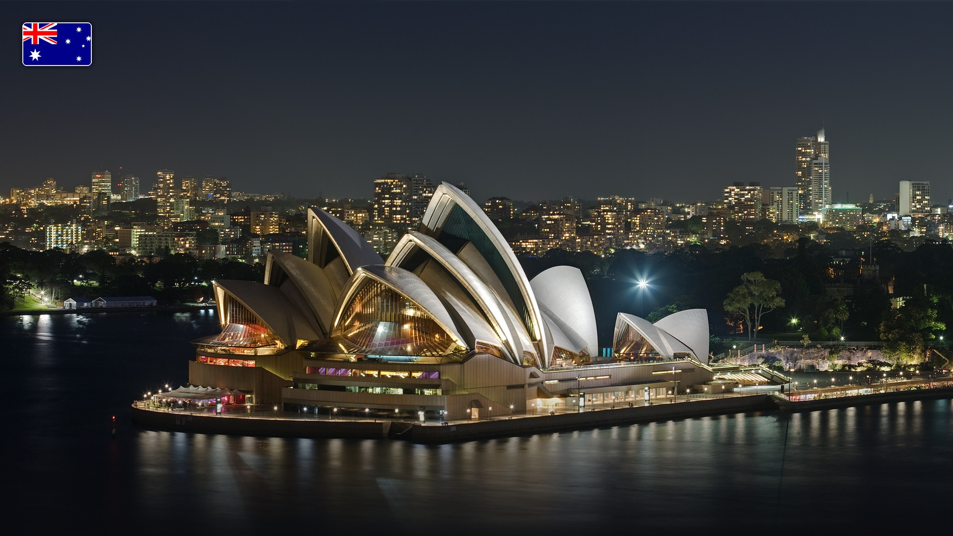 The Sydney Opera House sails and Sydney Harbour Bridge, with the flag of Australia.