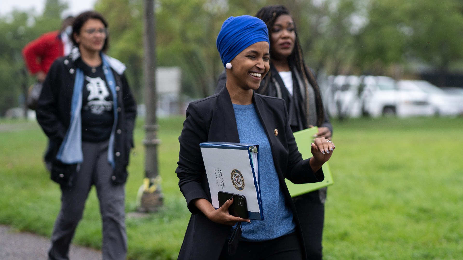 Rep. Ilhan Omar walking with Rashida Tlaib and Cori Bush