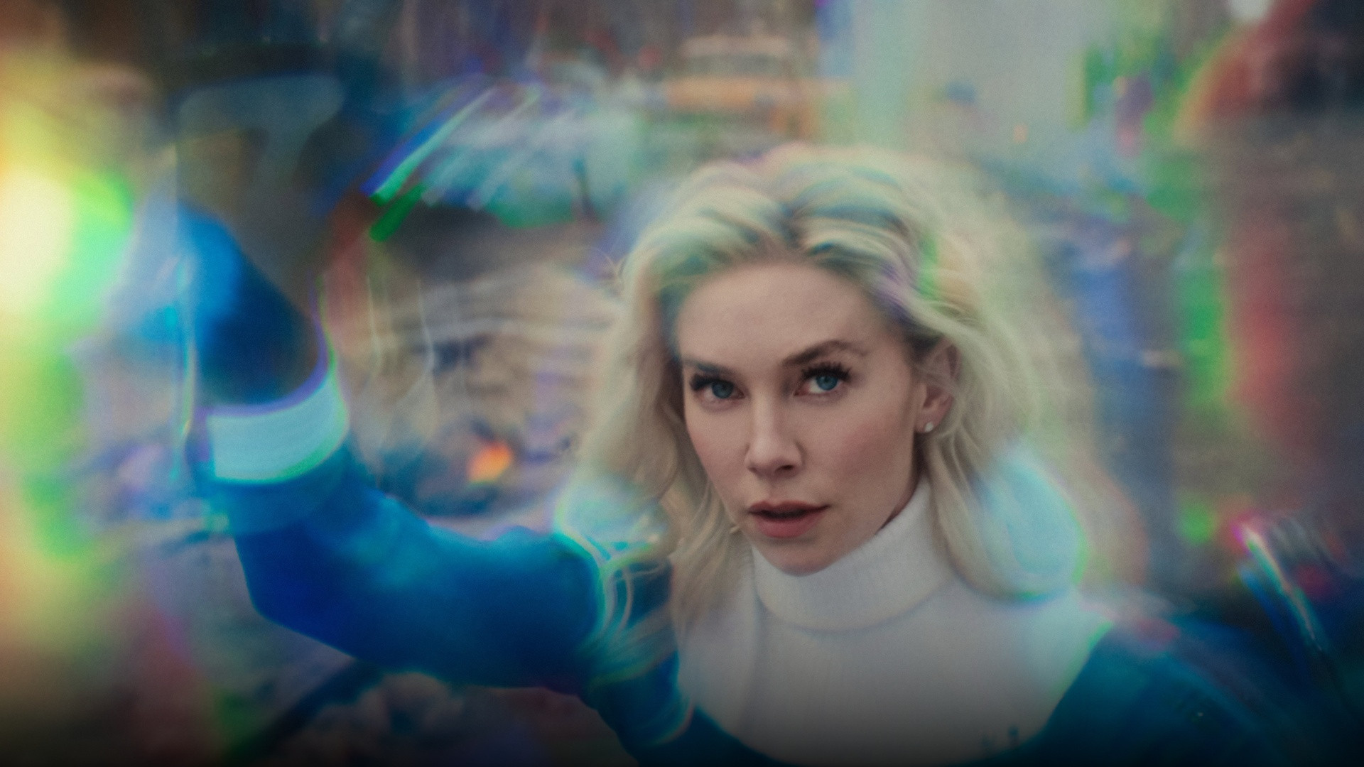 Vanessa Kirby as Sue Storm close-up projecting chromatic psionic forcefields with her outstretched hand.