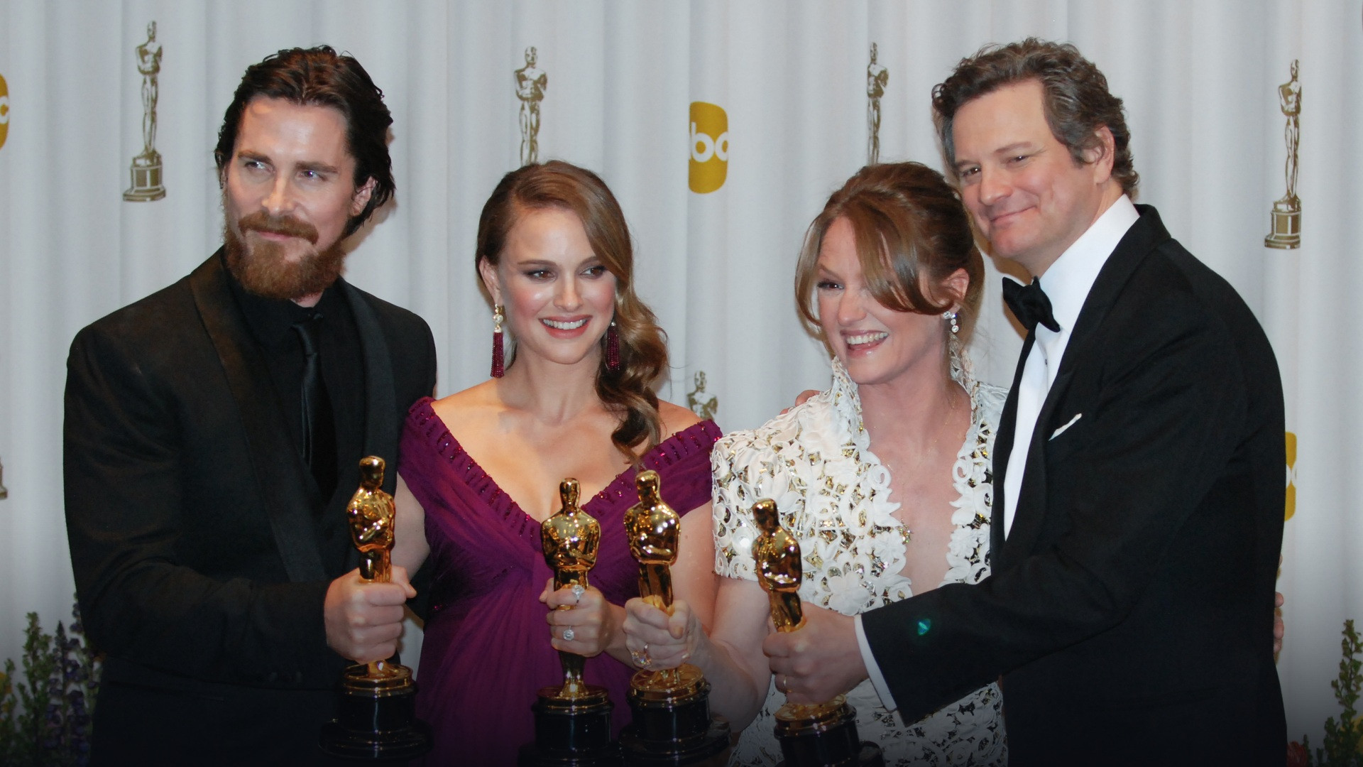 Natalie Portman holding her Best Actress Academy Award statue backstage at the 2011 Oscars