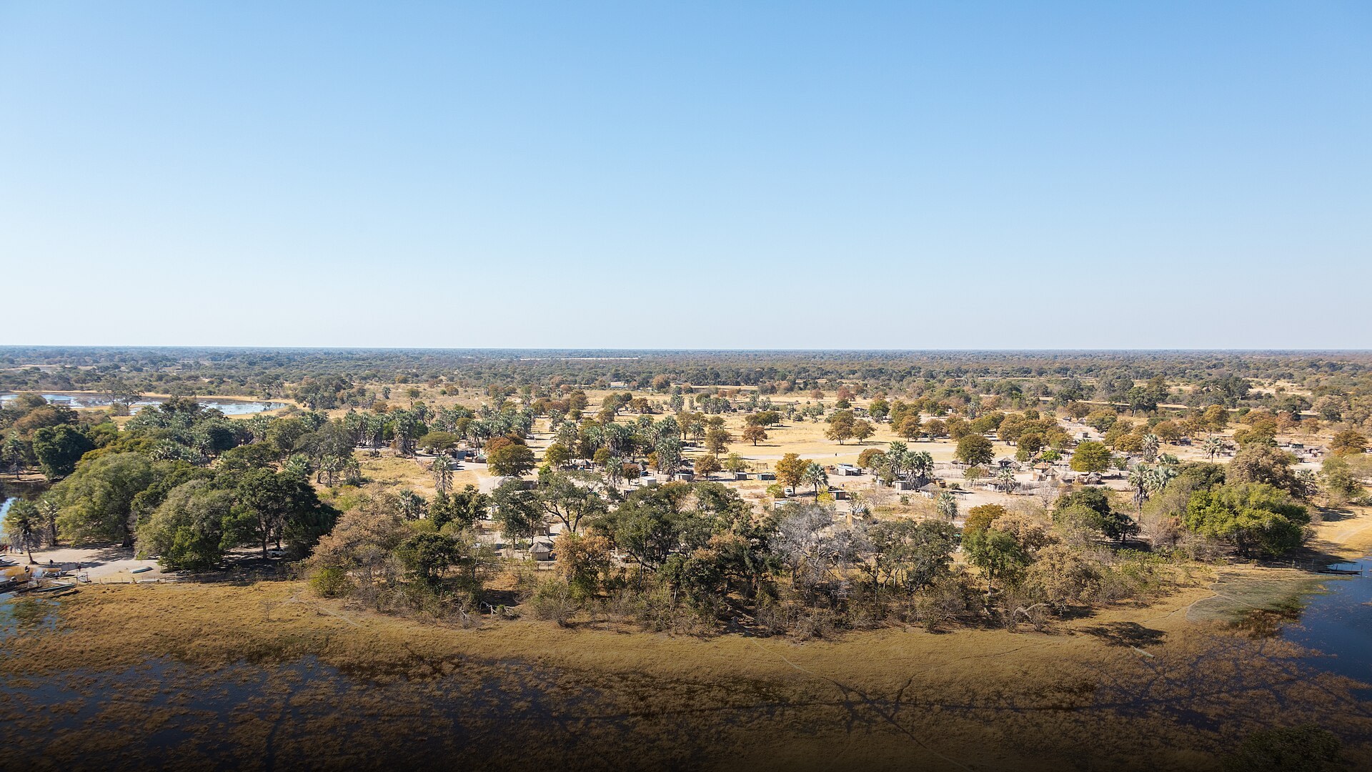 Aerial view of winding channels and lush green islands in the Okavango Delta wilderness in Botswana.