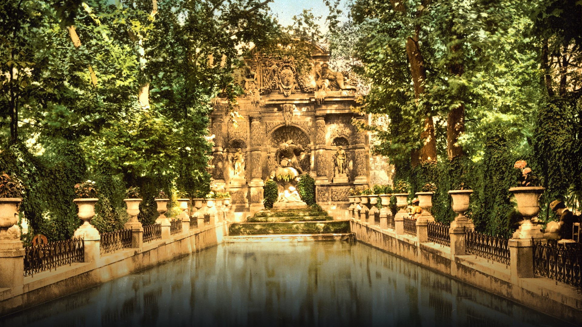 The Renaissance Medici Fountain surrounded by lush greenery in the Luxembourg Gardens.