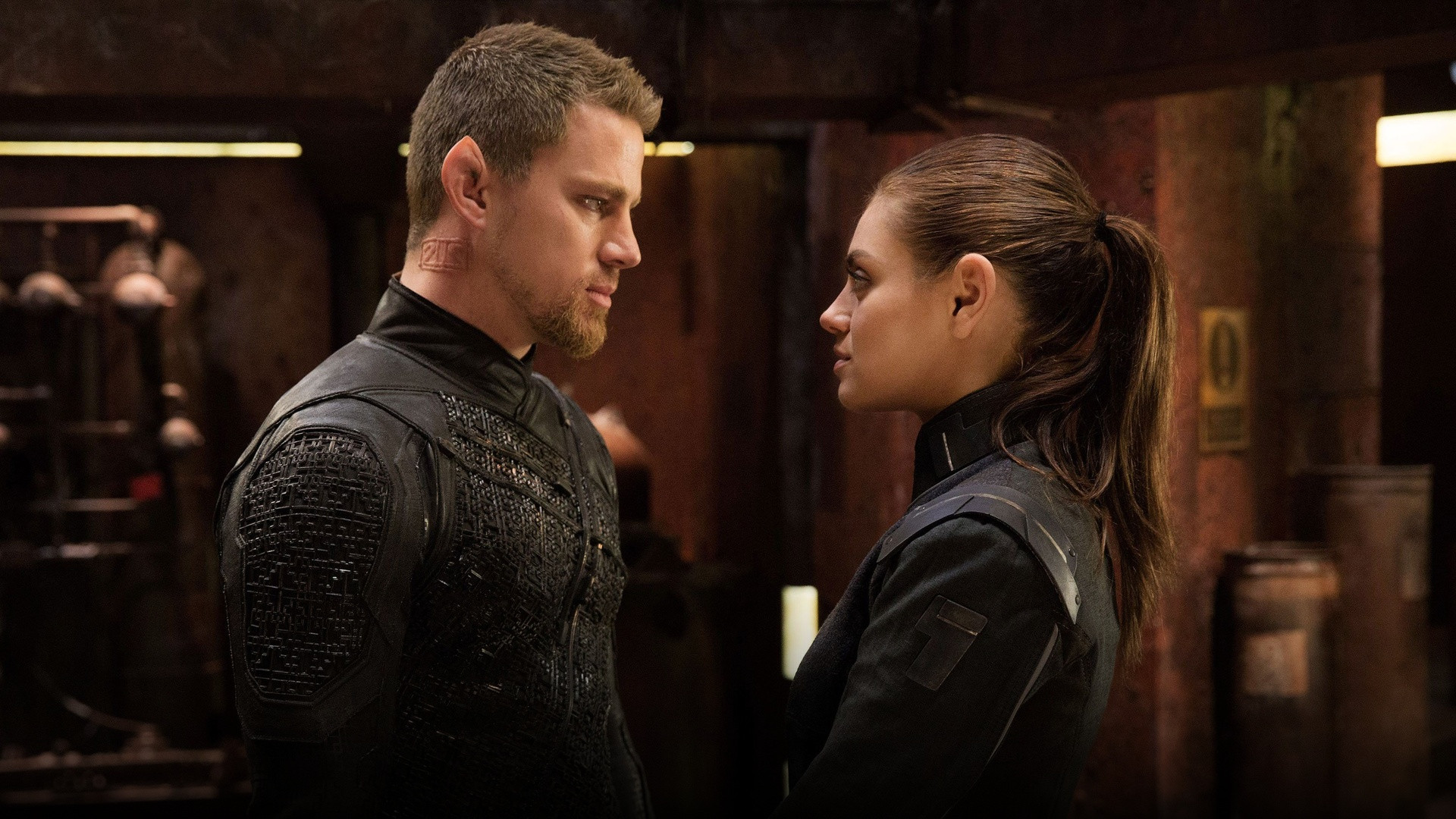 Channing Tatum as Caine Wise and Mila Kunis as Jupiter Jones confronting each other in Jupiter Ascending.