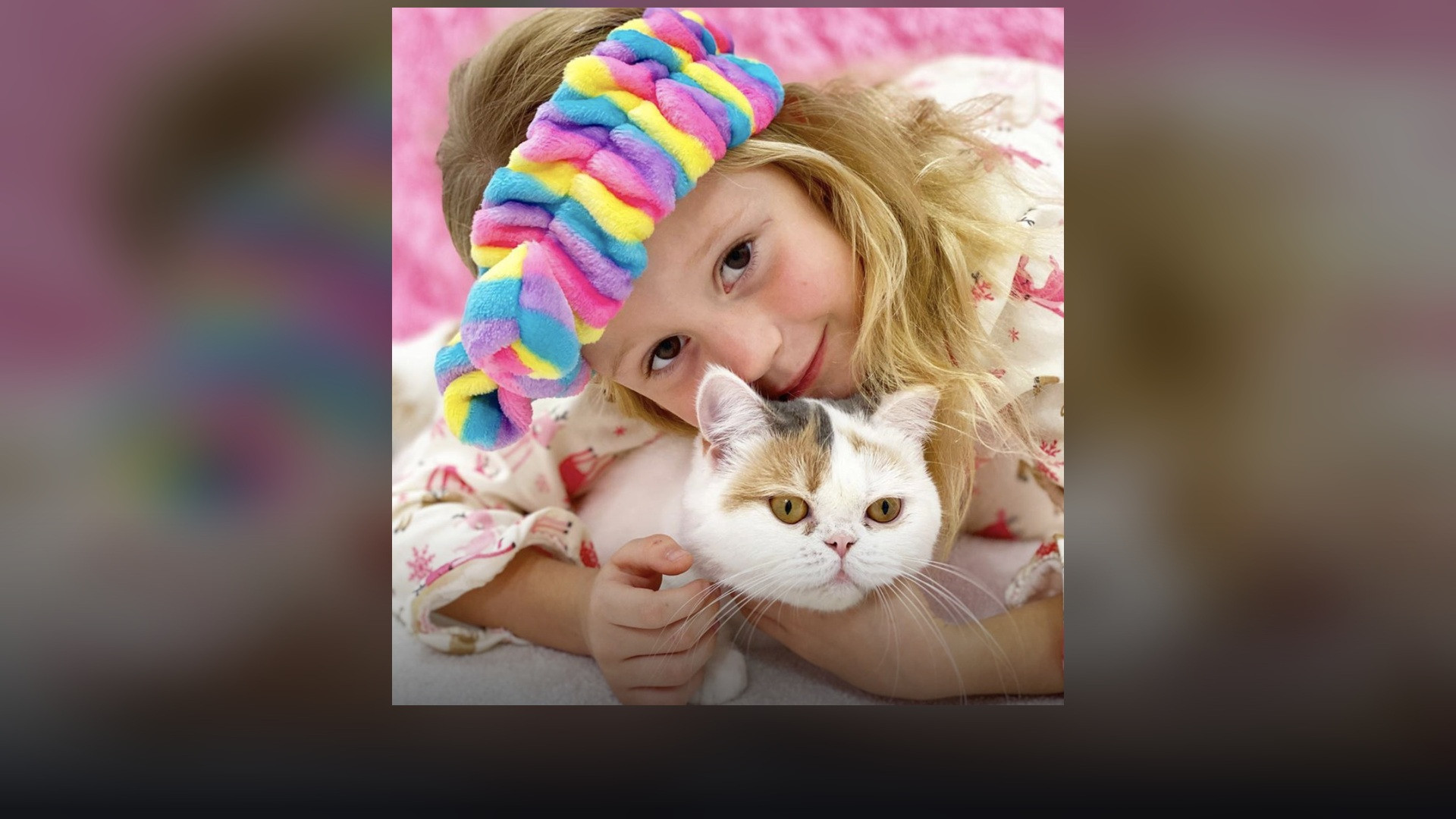 Anastasia Radzinskaya, known as Like Nastya, photographed with her cat.