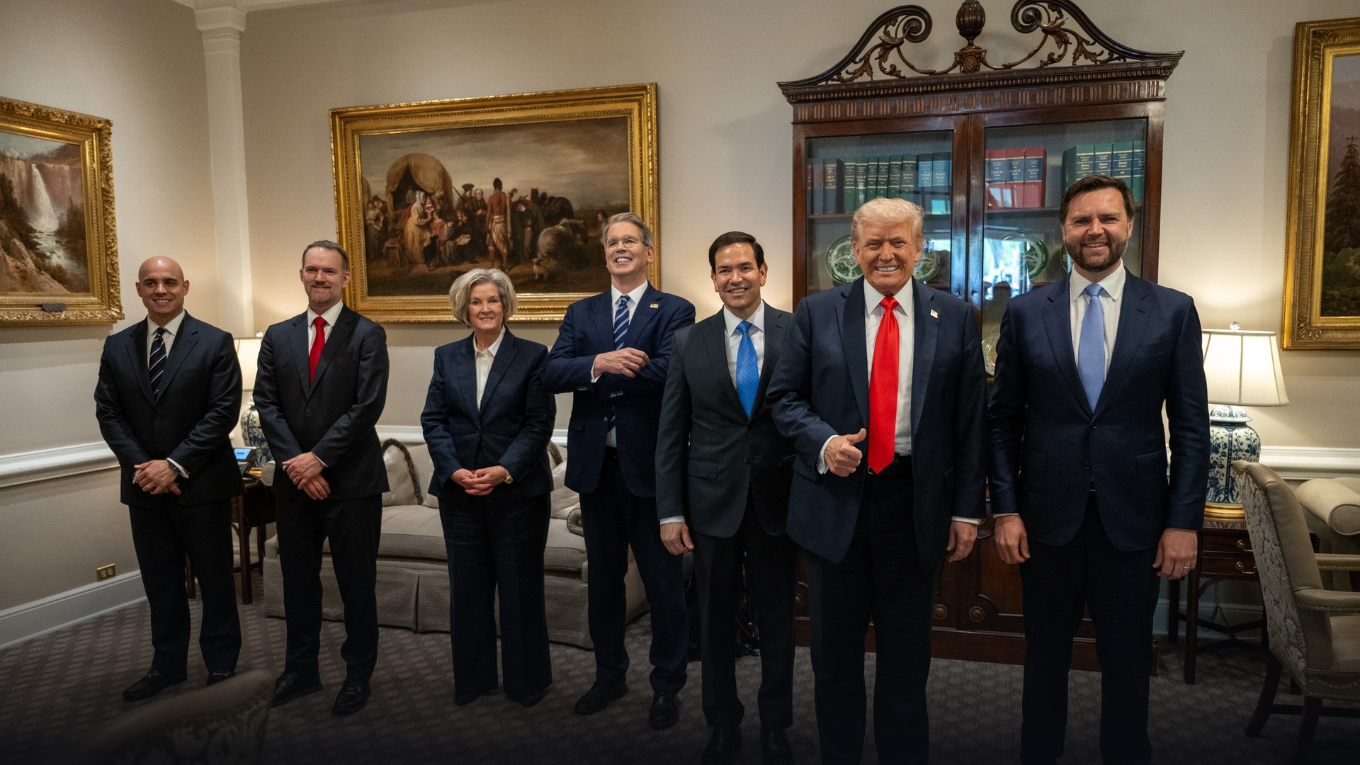 President Donald Trump posing in the West Wing Lobby of the White House alongside Chief of Staff Susie Wiles, Marco Rubio, Scott Bessent, and JD Vance.