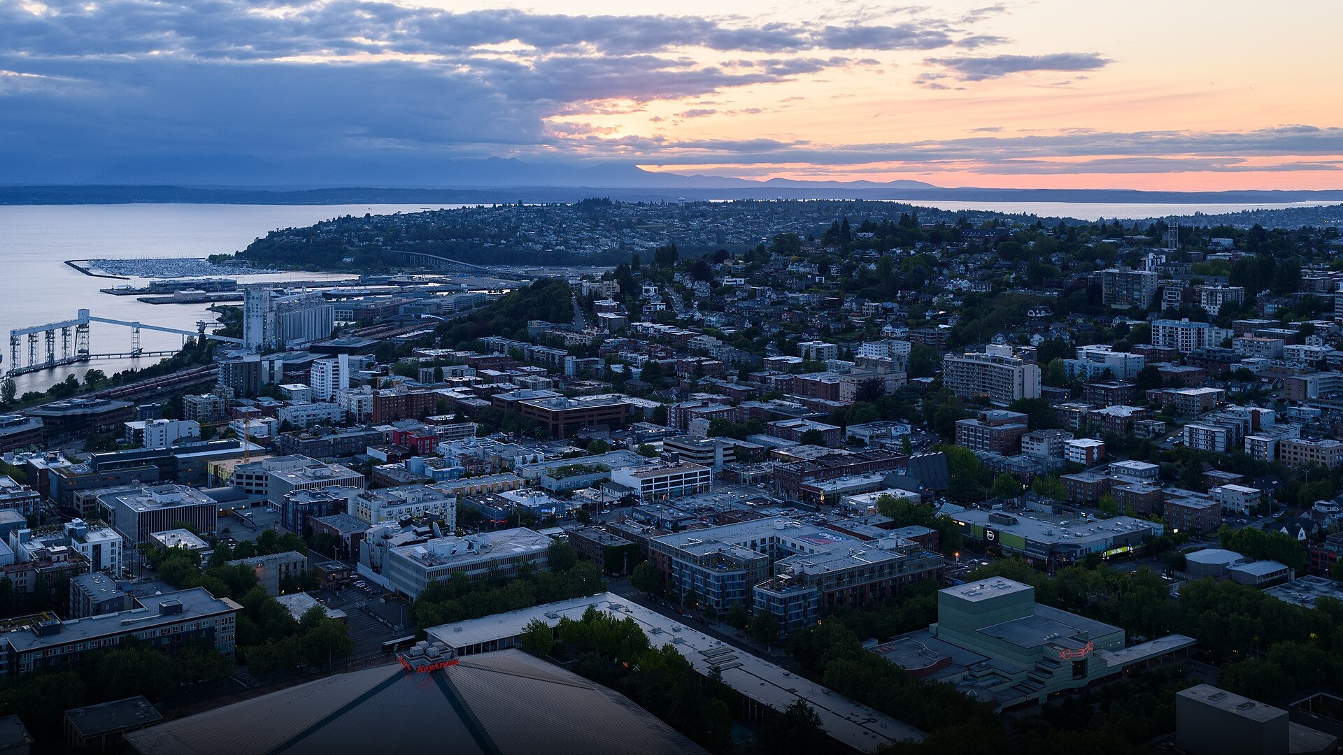 Elevated panoramic cityscape of downtown Seattle and Puget Sound viewed from the Space Needle.