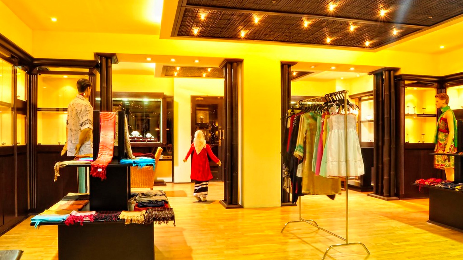 Boutique retail shop interior with display racks and stylish shelving.