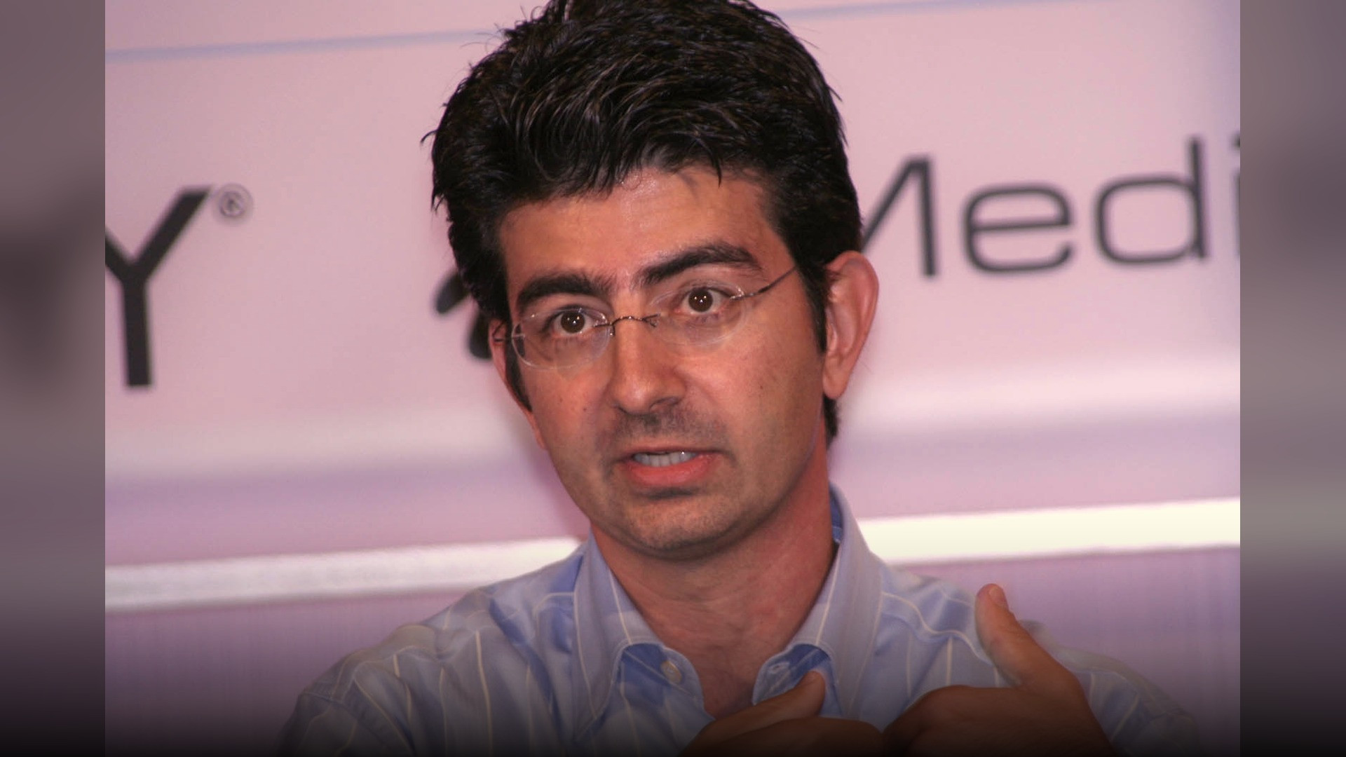 Pierre Omidyar speaking at a global media leadership summit.