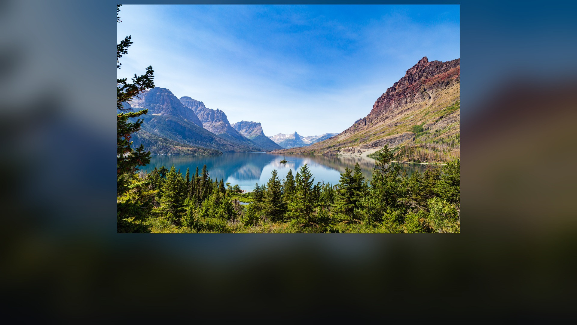 Panoramic landscape vista of Glacier National Park showing natural geological formations, terrain, and wilderness.