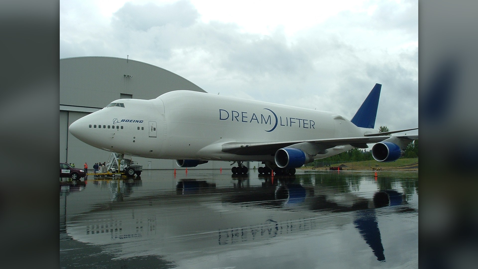 Boeing 747-400LCF Dreamlifter cargo aircraft parked on the airport tarmac.