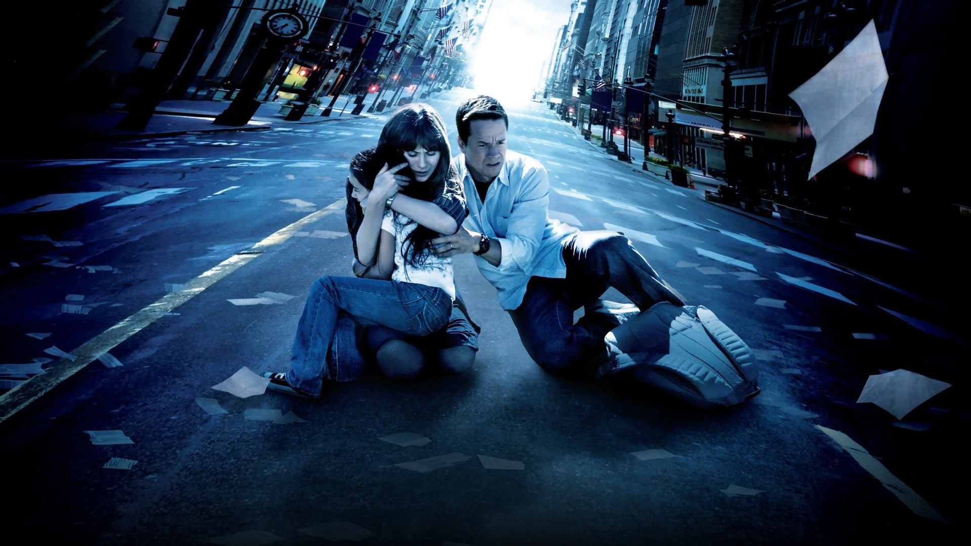 Mark Wahlberg and Zooey Deschanel running frantically through rolling open Pennsylvania countryside as trees sway in the wind