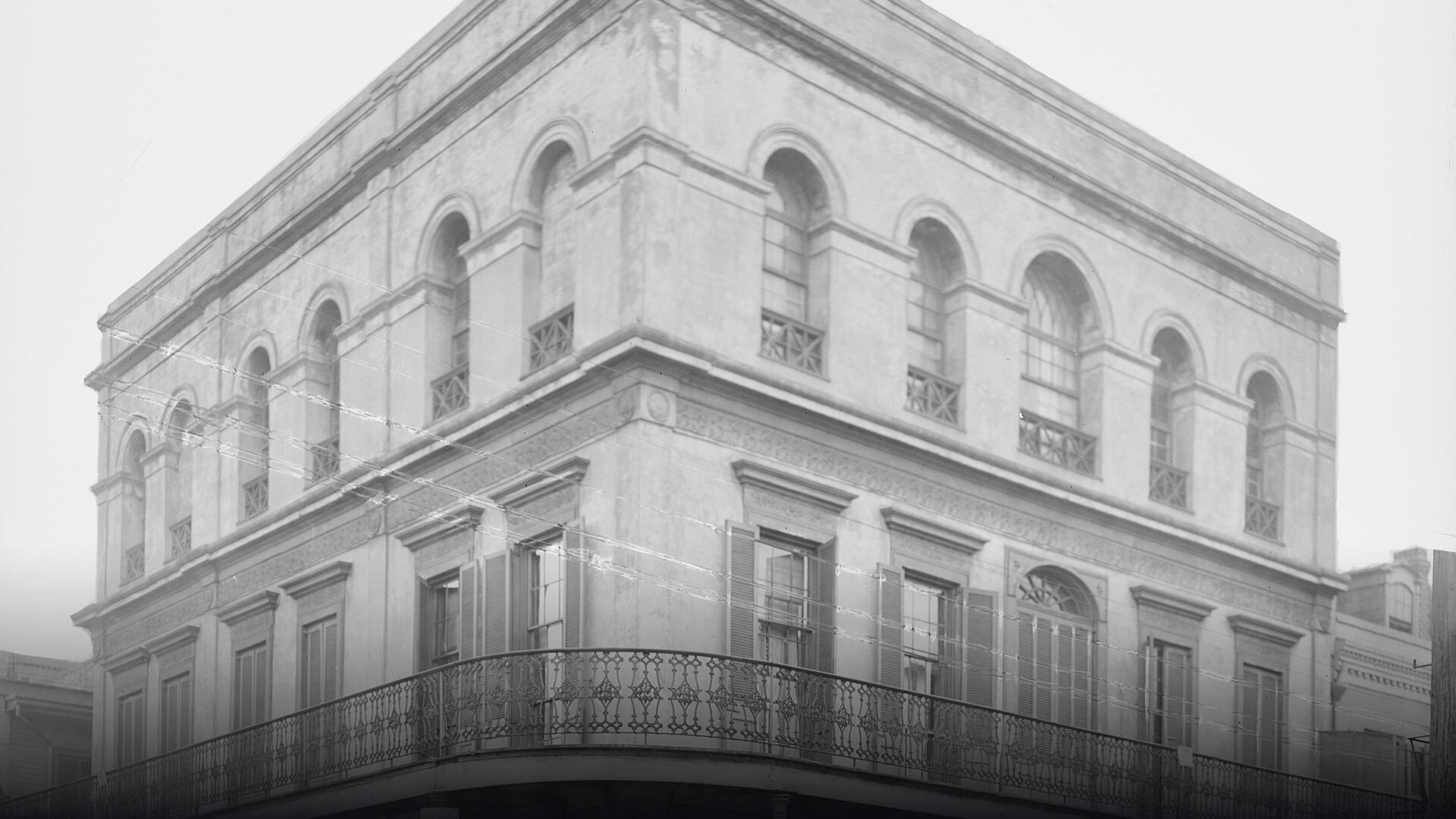 Historic corner view of the ornate three-story LaLaurie Mansion at Royal and Governor Nicholls Streets in New Orleans.