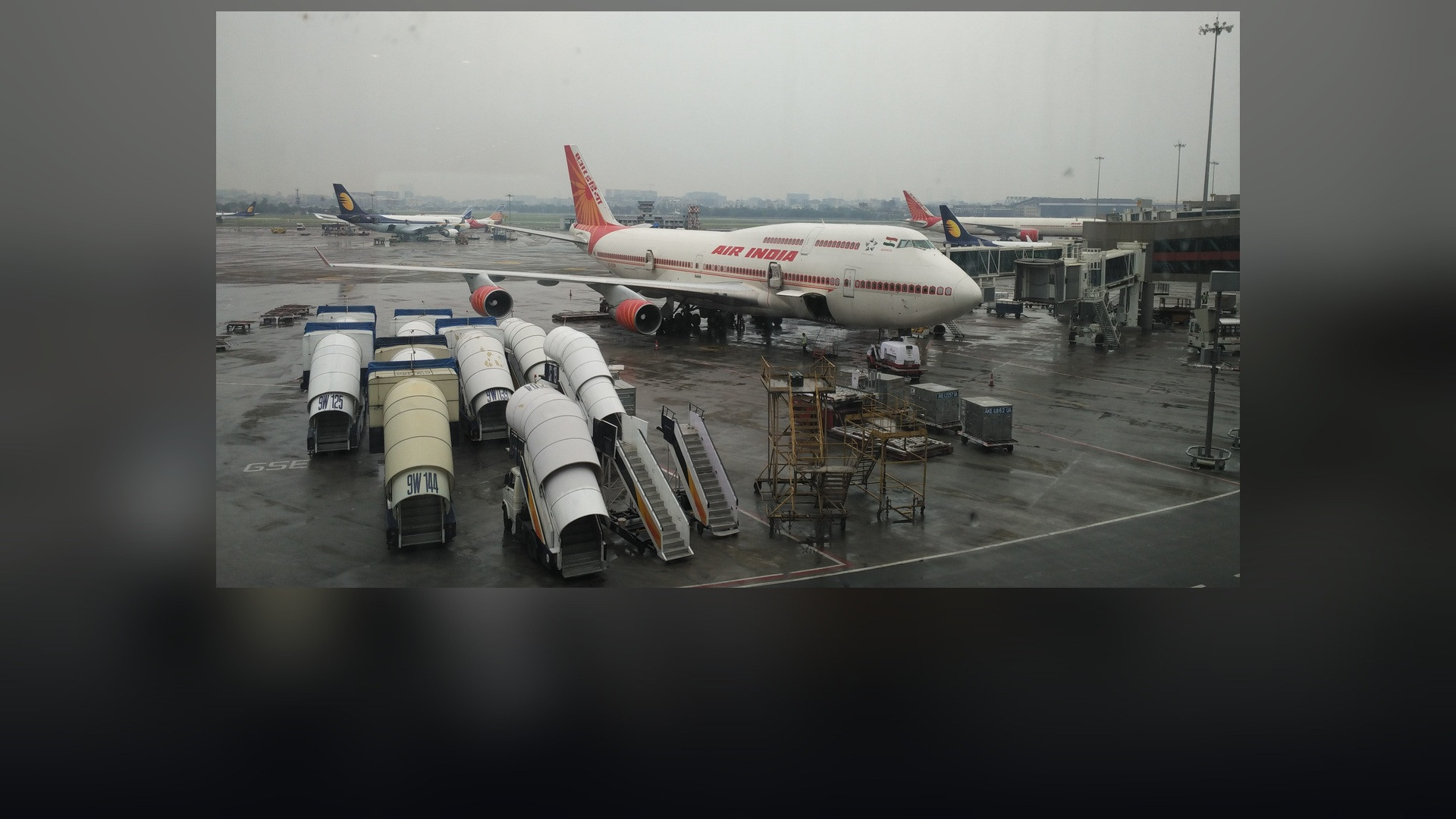 Air India Boeing 747 jumbo jet in service with distinctive crimson Rajasthani palace-window livery.